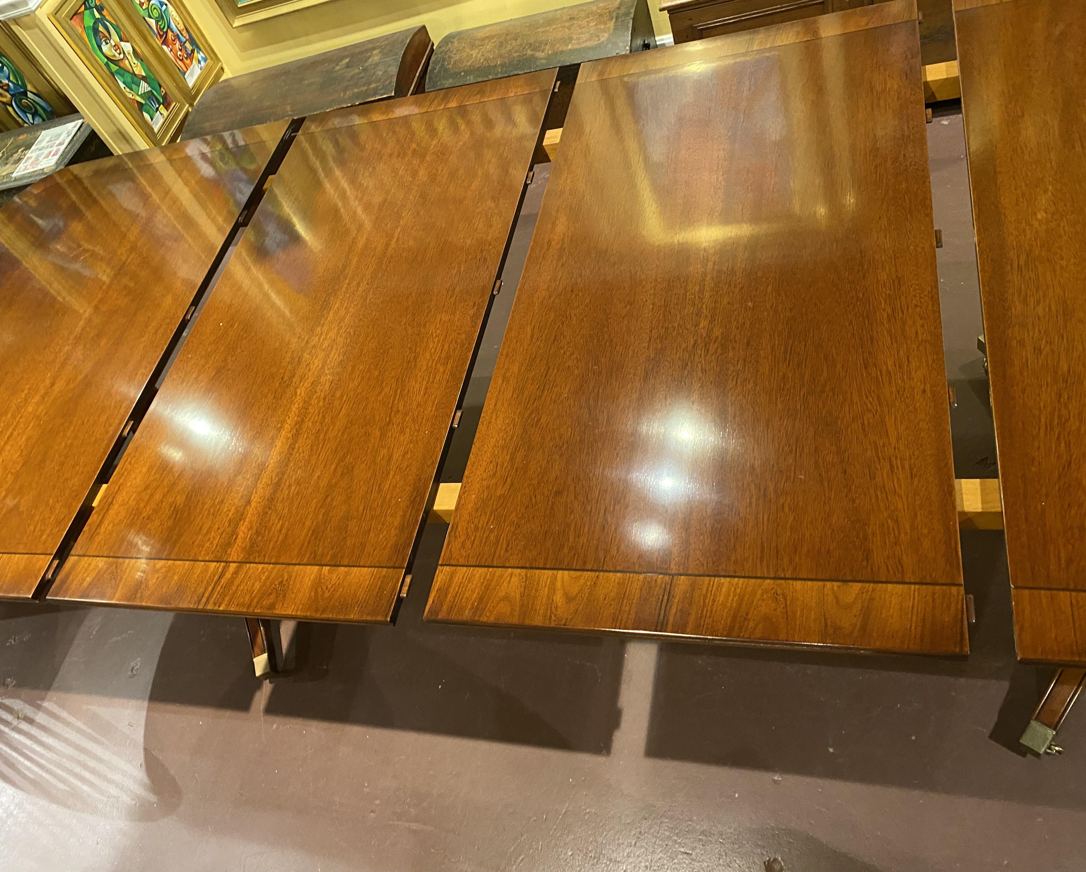 20th Century Georgian Style Mahogany Double Pedestal Banded Dining Table with Two Leaves