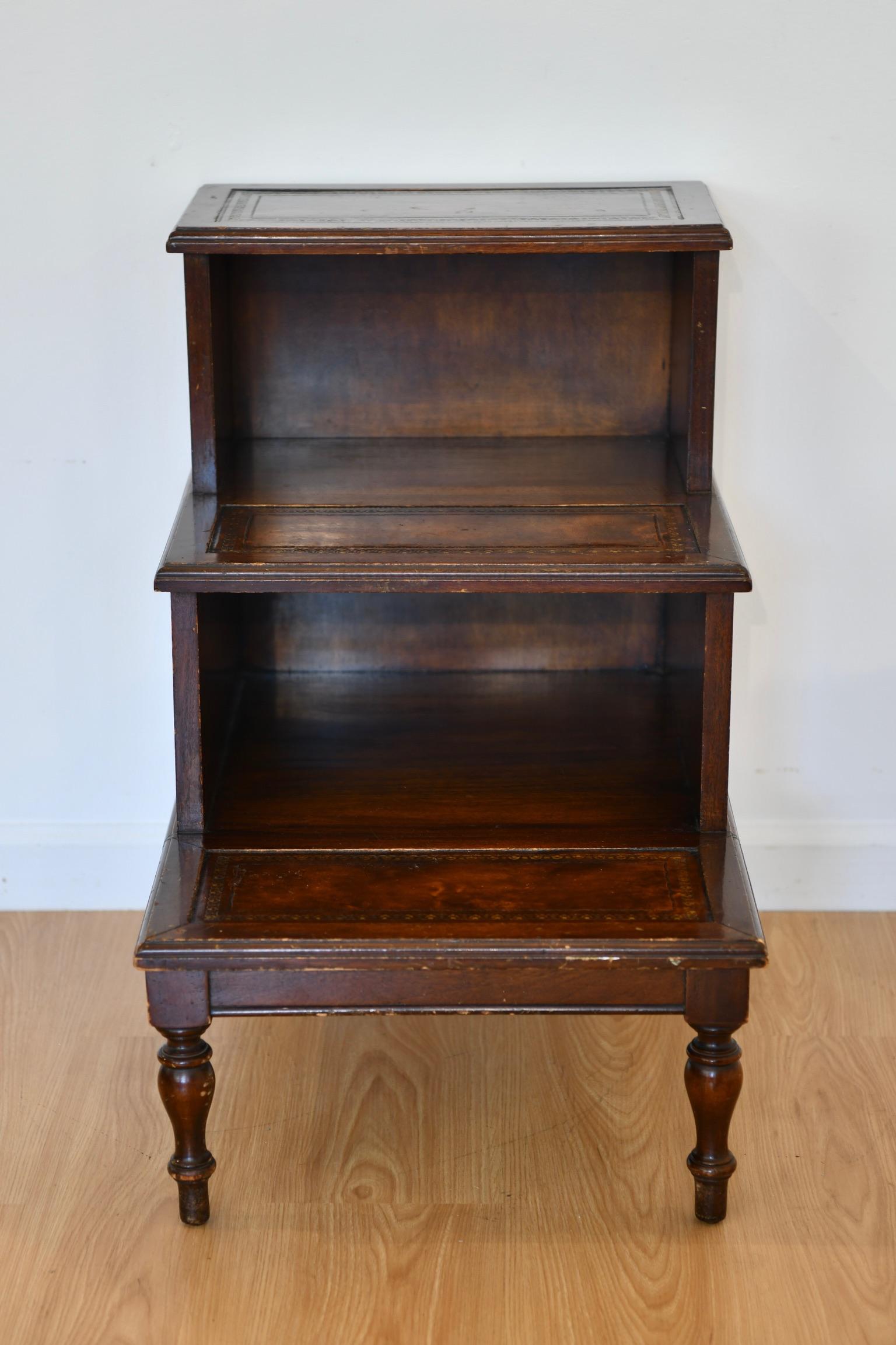 Georgian-style mahogany step table with inset tops and turned feet. Dimensions: 27