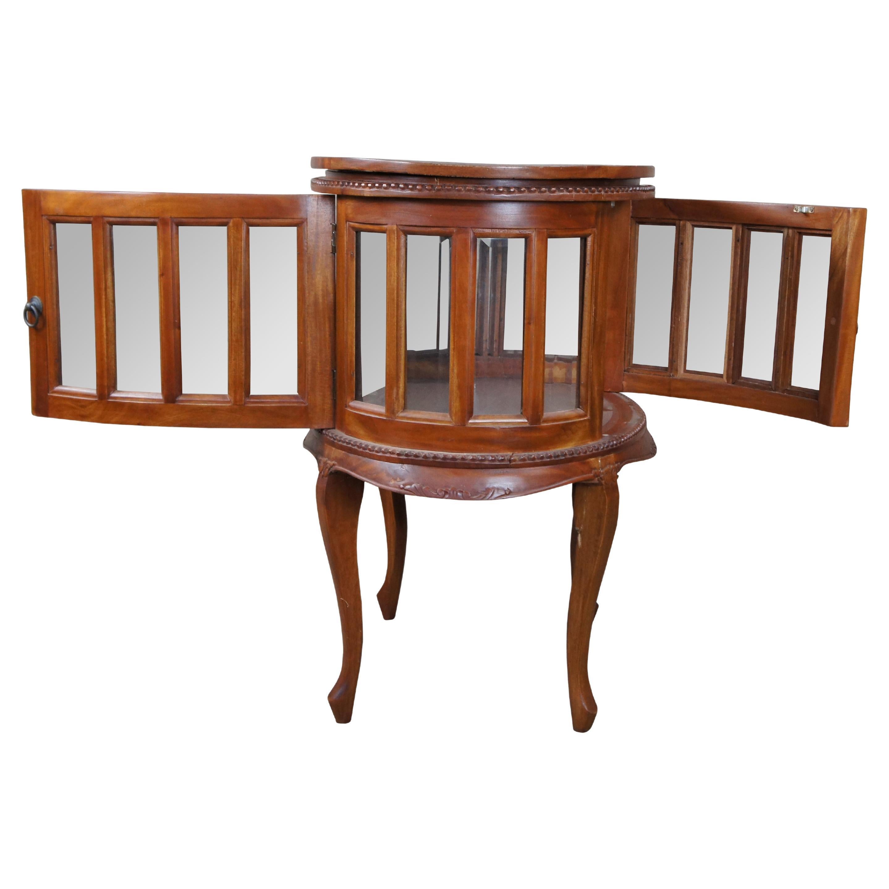 Georgian style Chocolate / Tea table or vitrine cabinet, circa last quarter 20th century.  Features an oval frame and tray top over a lower two sided showcase with beveled glass.  The table can be opened from each side and is accented by beaded
