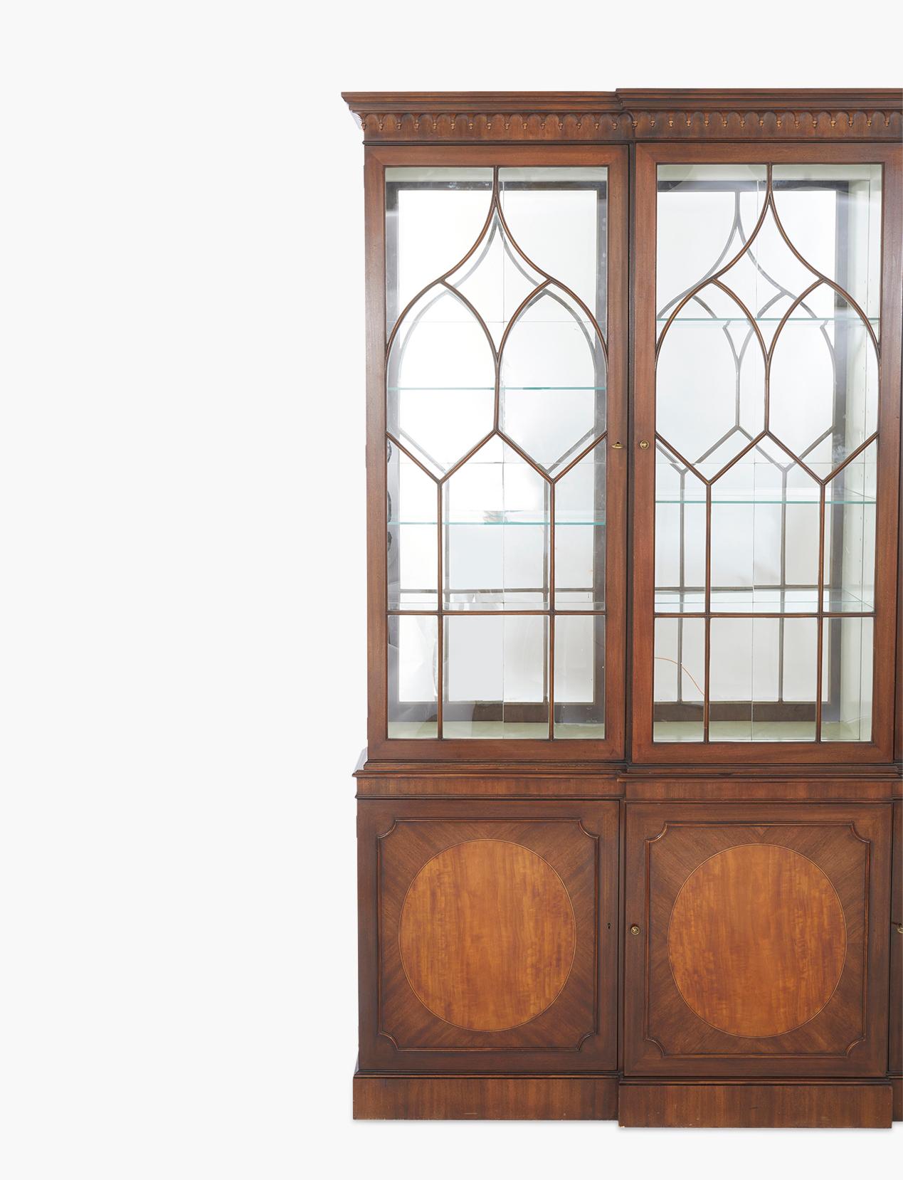 Beautifully hand crafted two part inlaid mahogany wood North American breakfront china cabinet / hutch. The upper part interior featuring white paint wall with glass shelves and mirrored back splash with three doors & locking keys. The breakfront is