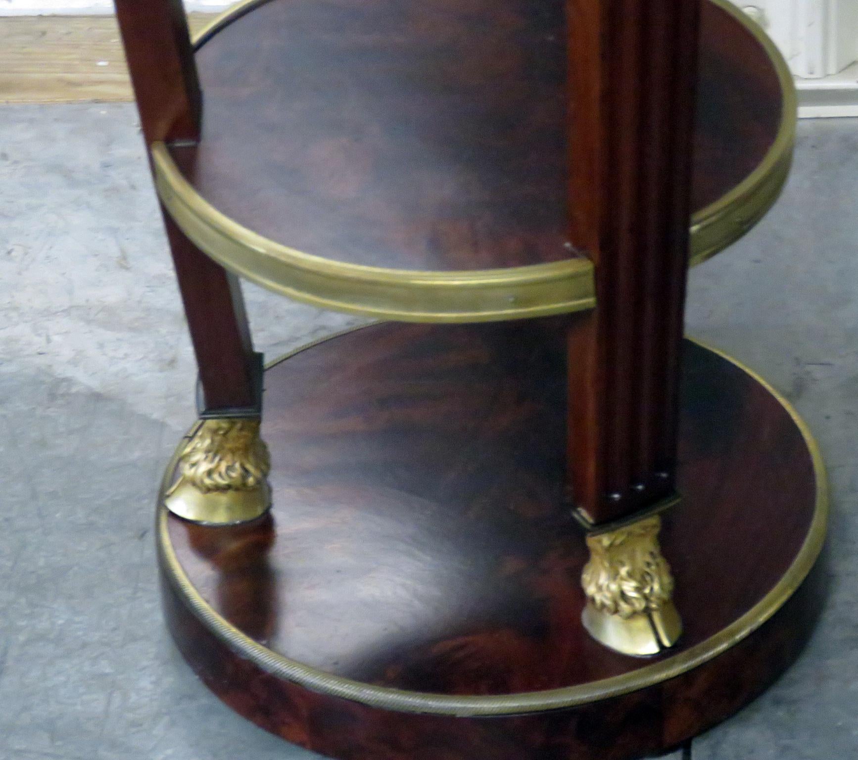 Georgian style marble top gueridon with brass accents and gallery.