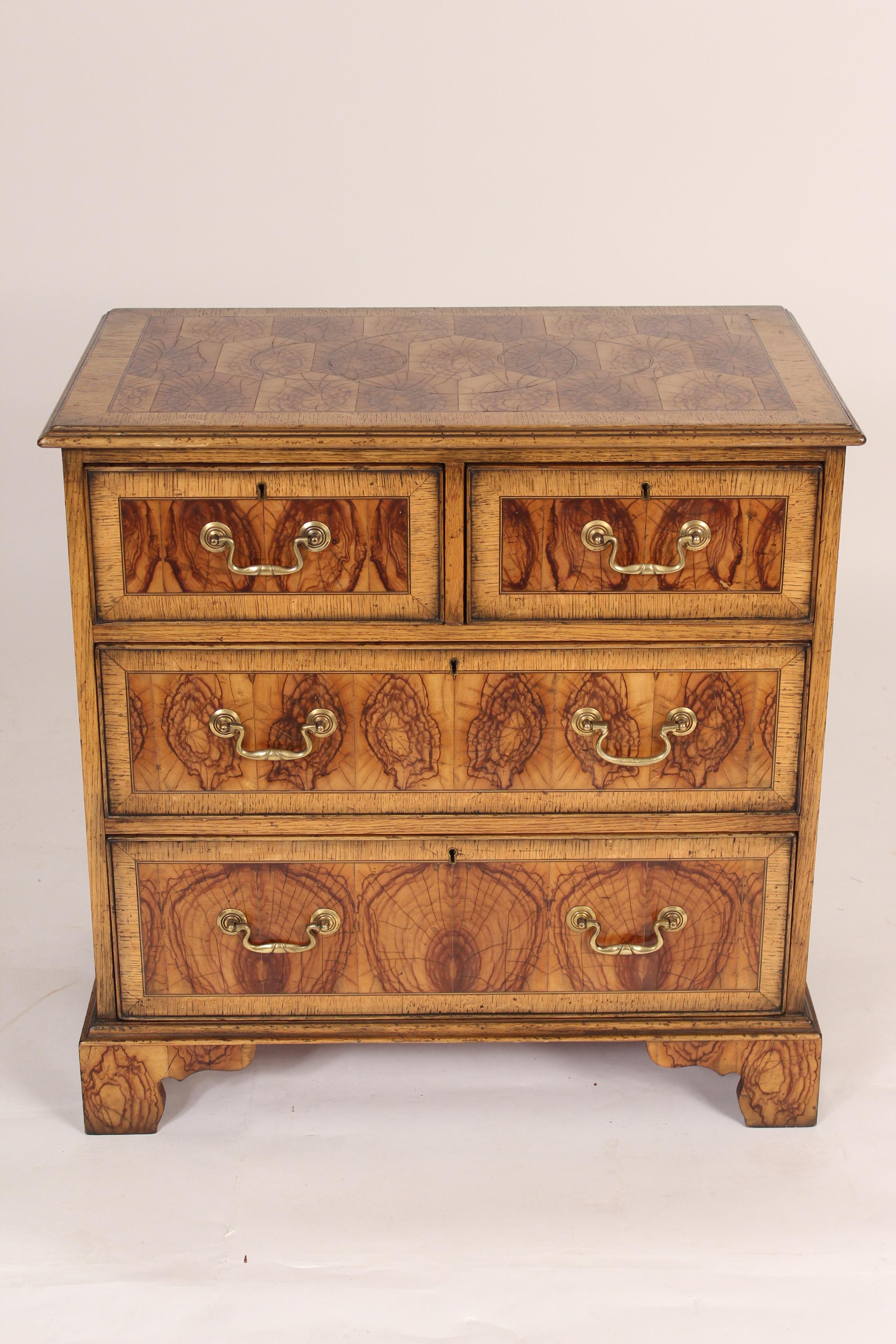 George II style oyster burl chest of drawers, circa mid-20th century. A rare type of wood, brass hardware and hand dovetailed drawer construction. The front and top are oyster burl the sides are oak.