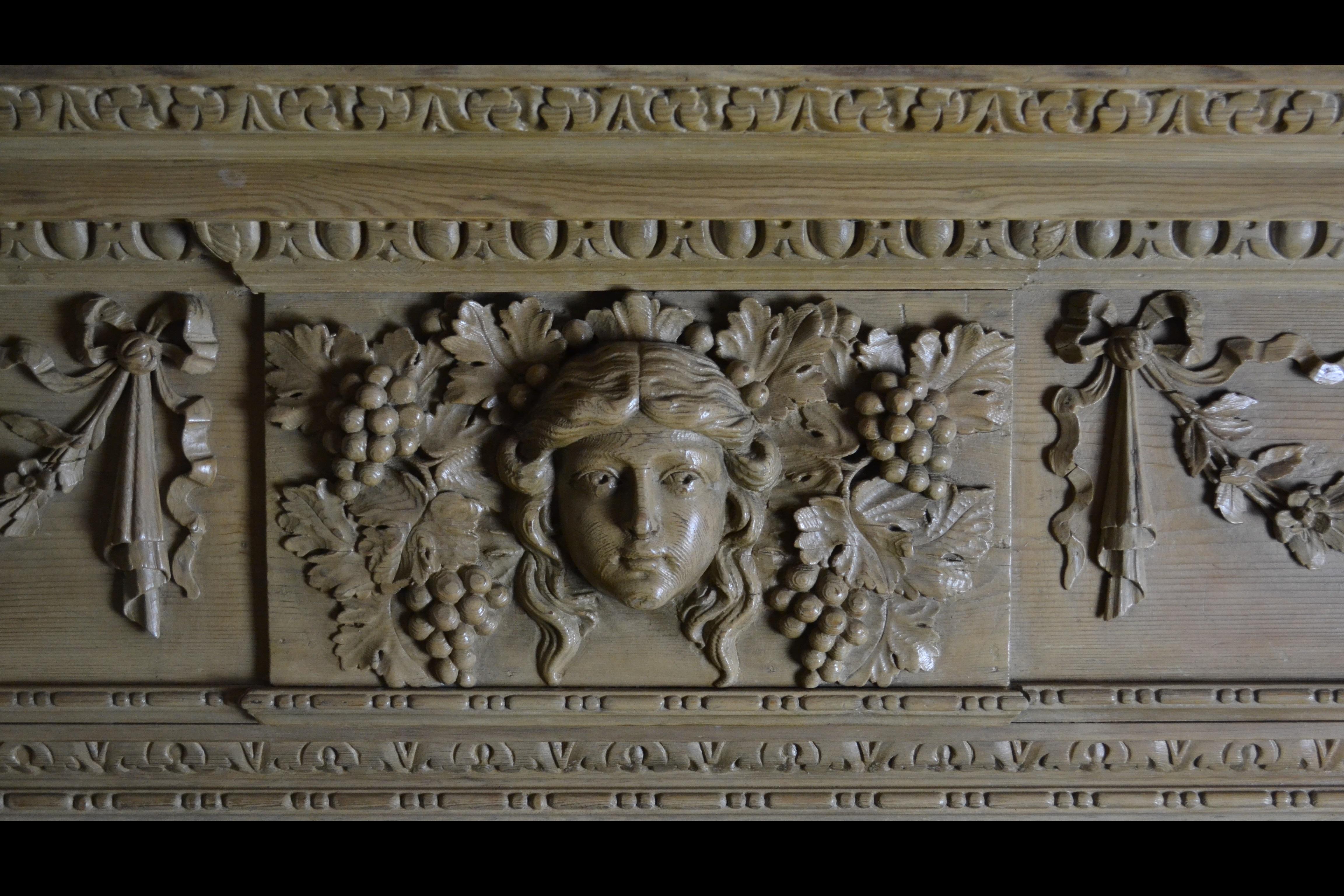 English Georgian Style Pine Mantelpiece with Mask Center Plaque
