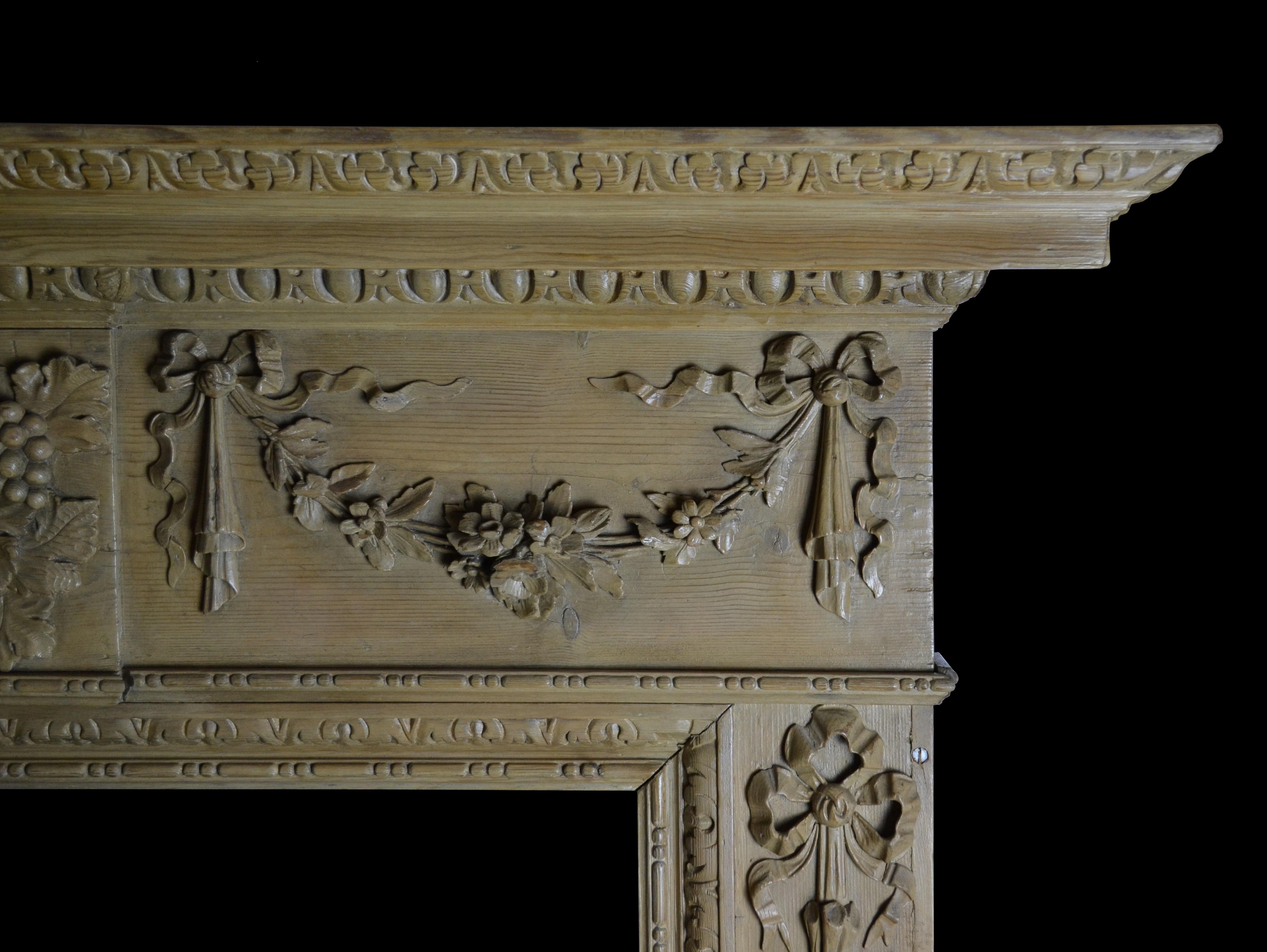 Hand-Carved Georgian Style Pine Mantelpiece with Mask Center Plaque