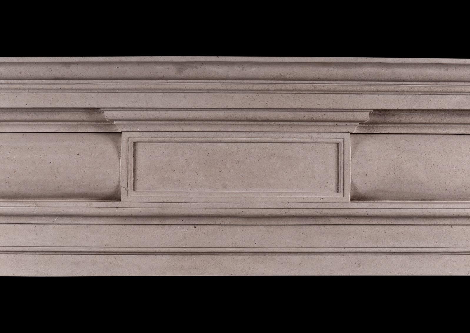 A good quality English Georgian style fireplace in Portland stone. The barrel frieze with centre panel, surmounted by moulded shelf. A fine quality copy of a period piece. N.B. May be subject to an extended lead time, please enquire for more