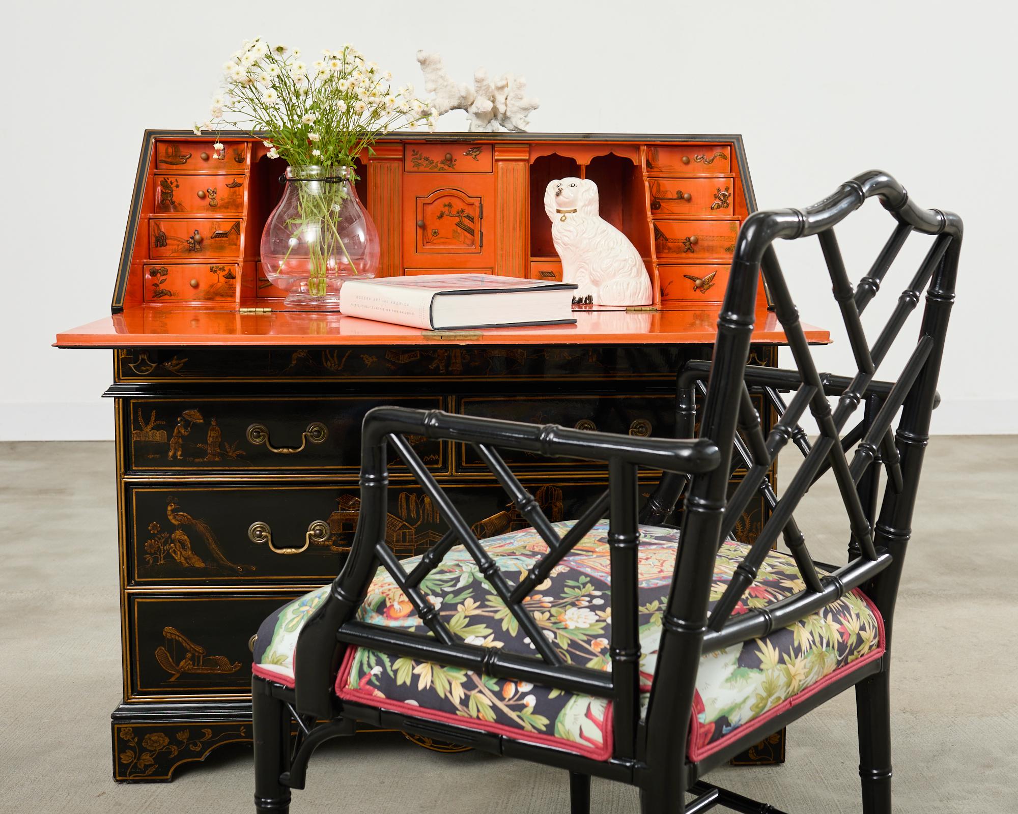Dramatic English George III style slant drop front secretary chest featuring a lacquered case decorated in the chinoiserie taste. The hardwood case has a large drop-front slant door that opens to a writing surface measuring 38 inches wide by 15