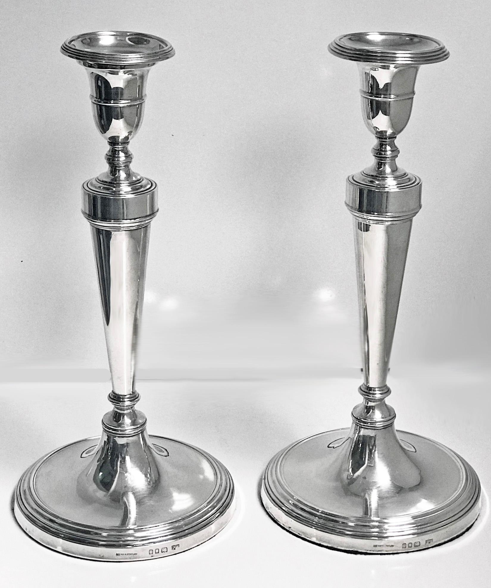 Georgian style sterling silver candlesticks, Mappin & Webb, London, 1930. 18th century Georgian style on circular loaded bases, vase shape plain stems, detachable bobeche. Size: Height 11.0 inches. Fully marked.