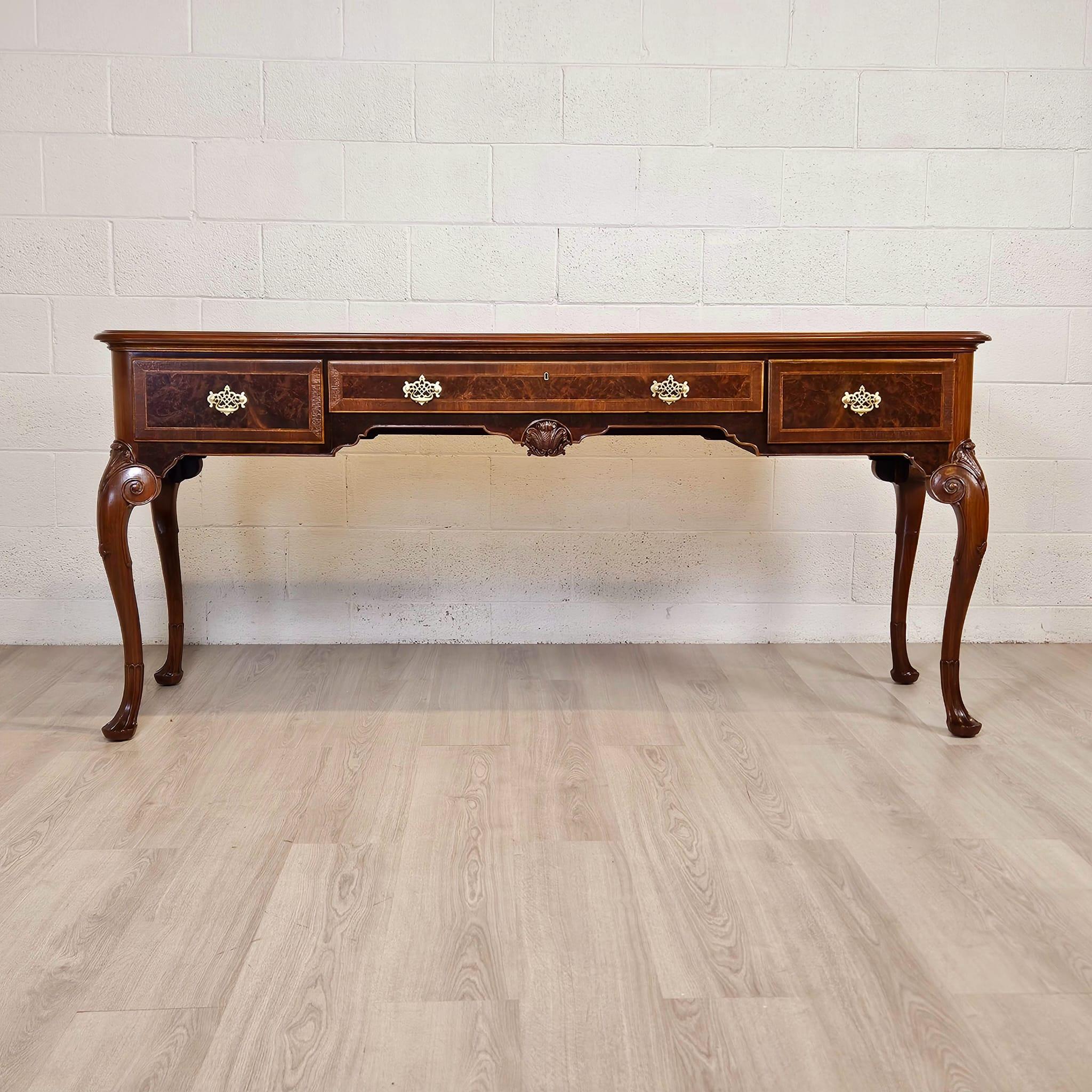 We are pleased to offer our Georgian Style Walnut Server Sideboard, Walnut with Burr Walnut Panels. 
A beautifully proportioned Georgian style sideboard on graceful cabriole legs with shell carving and details.  The walnut banding framing the walnut