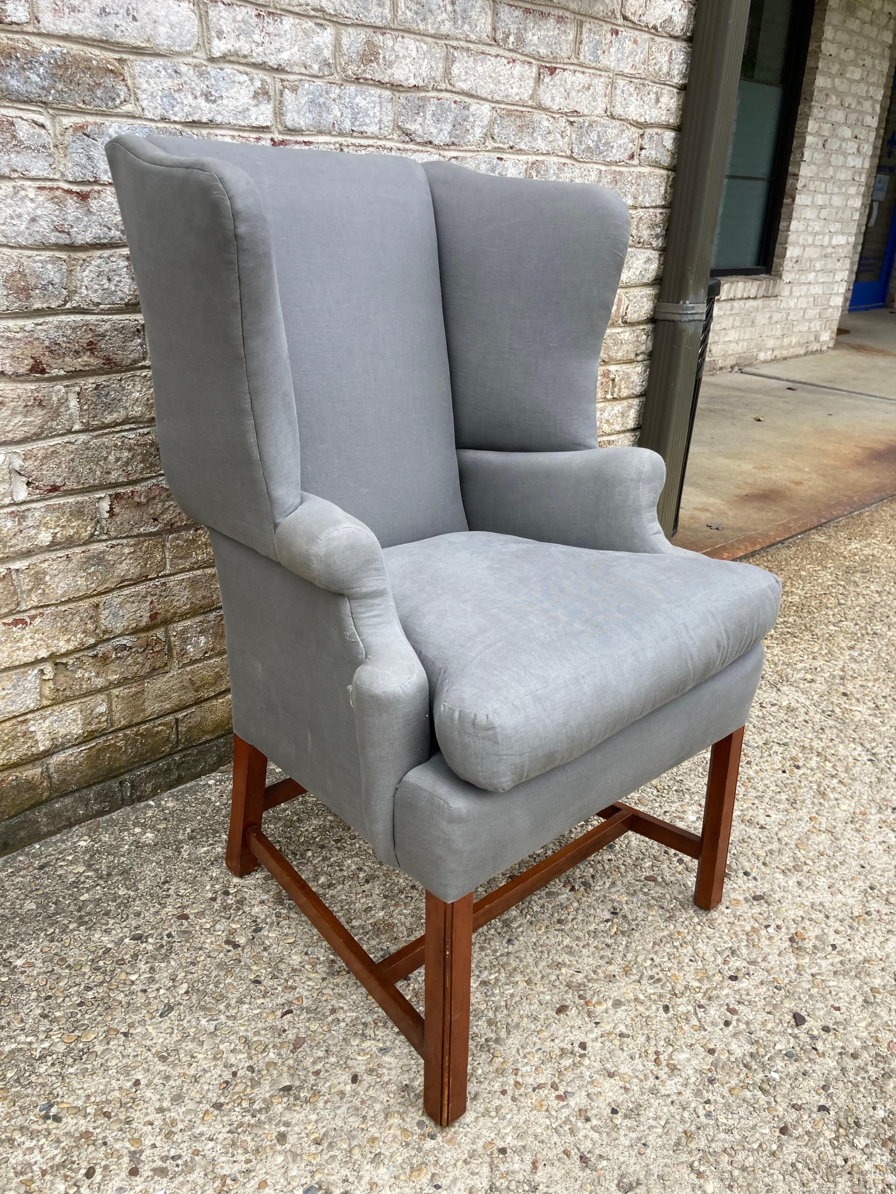 Very special petite Georgian style wingback chair newly upholstered in grey linen.