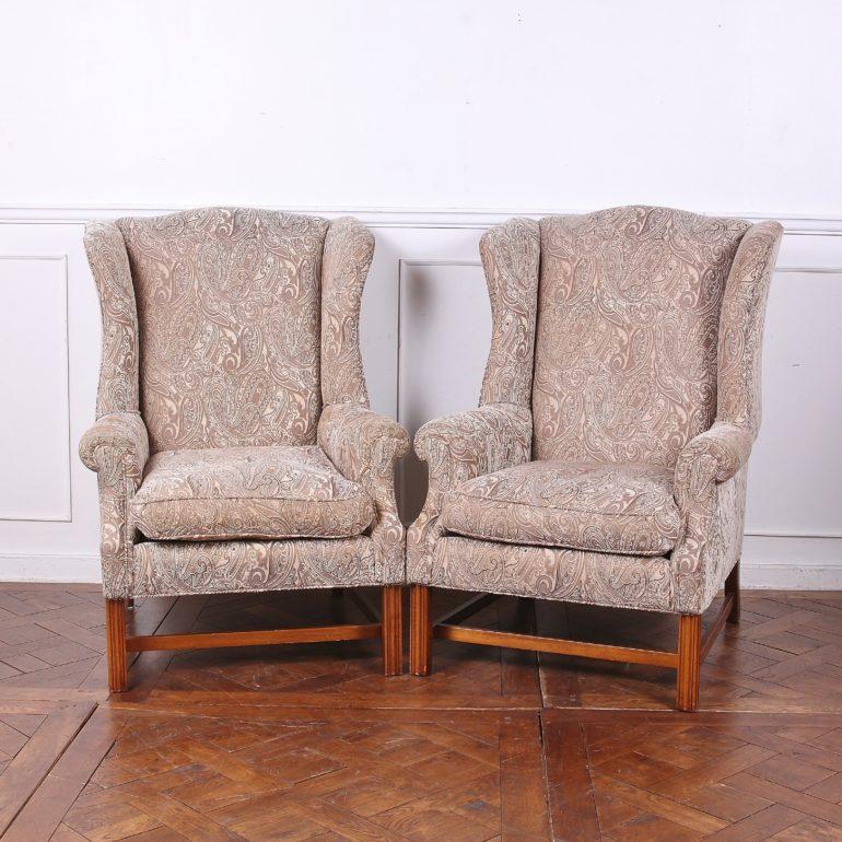 A handsome pair of vintage Georgian-style wing-back chairs.



  