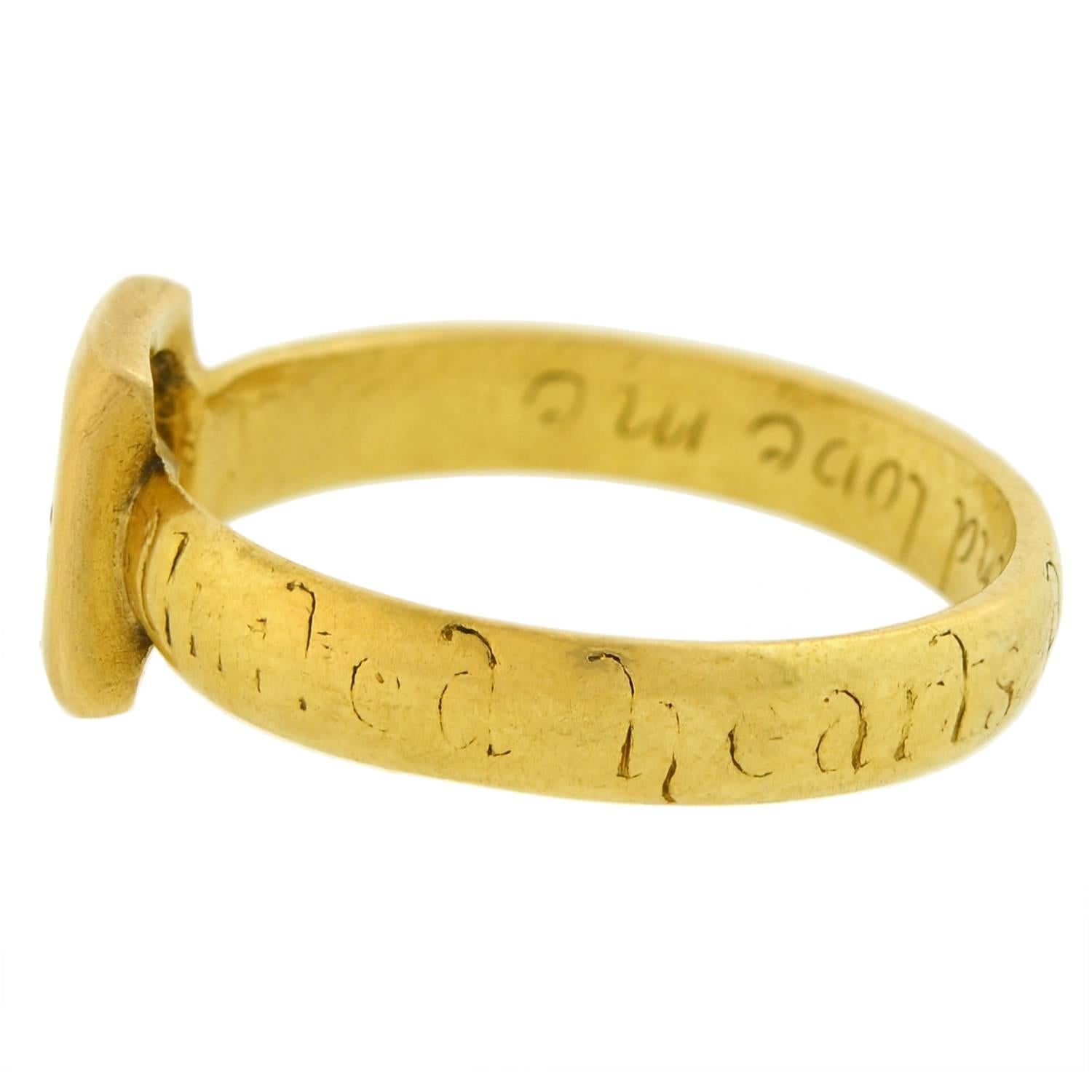 A very unusual and special diamond ring from the Georgian (ca1820) era! This rare single stone piece features a lovely and romantic design crafted in vibrant 18kt yellow gold. A sparkling old Tablet Cut diamond rests at the center, held within a