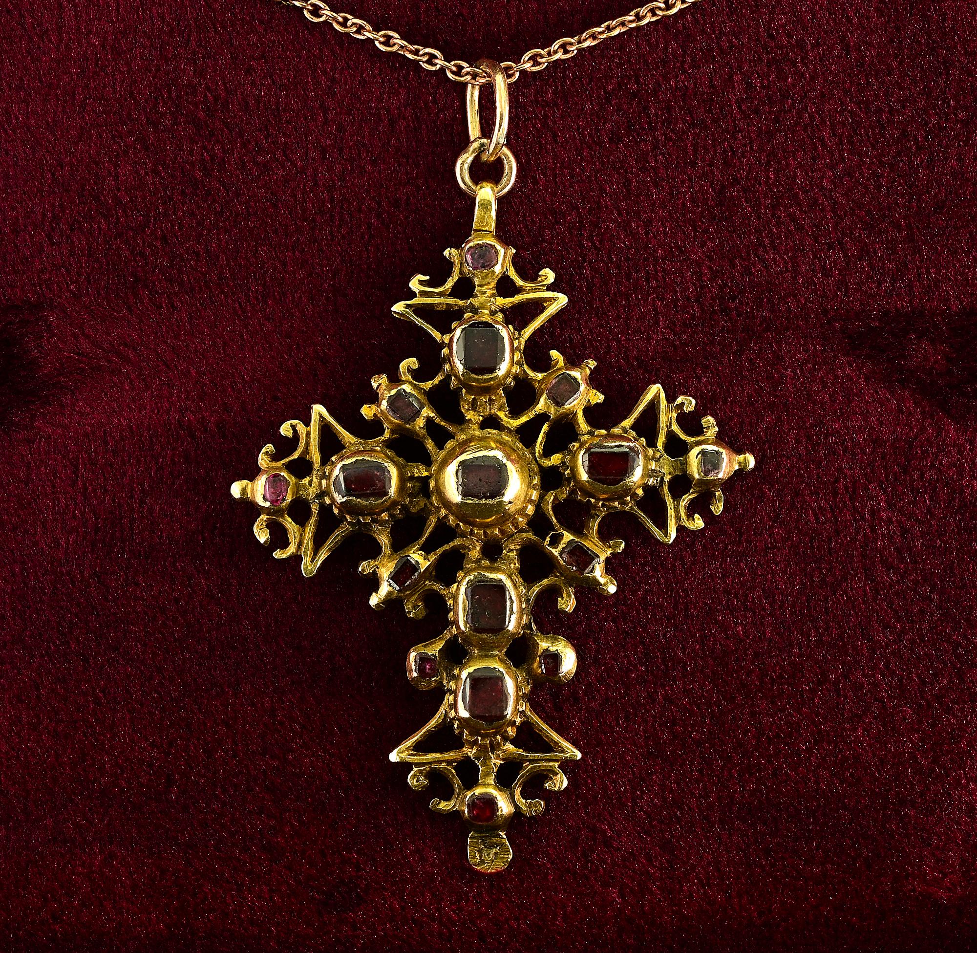 This beautiful antique cross is Georgian era 1740 ca – Possibly French from the hallmarks
Superb 18 KT past artwork of the era with rare design and rich back details
Adorned with a selection of table cut natural Garnets complemented by six natural