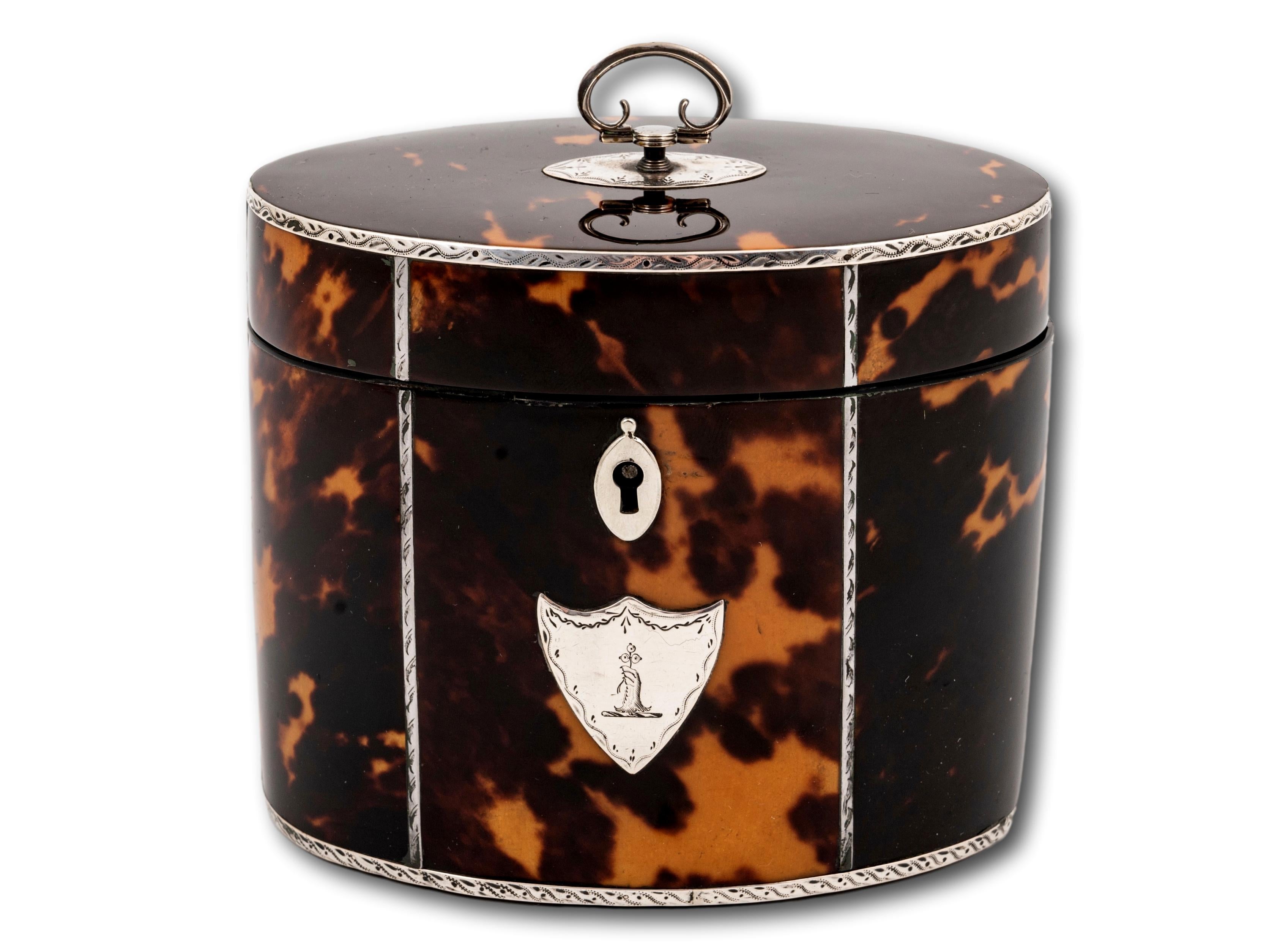 Oval Tea Caddy with Silver Mounts

From our Tea Caddy collection, we are delighted to offer this Georgian Silver and Tortoiseshell Tea Caddy. The Tea Caddy is of oval shape with a Tortoiseshell exterior mounted with engraved silver stringing, a