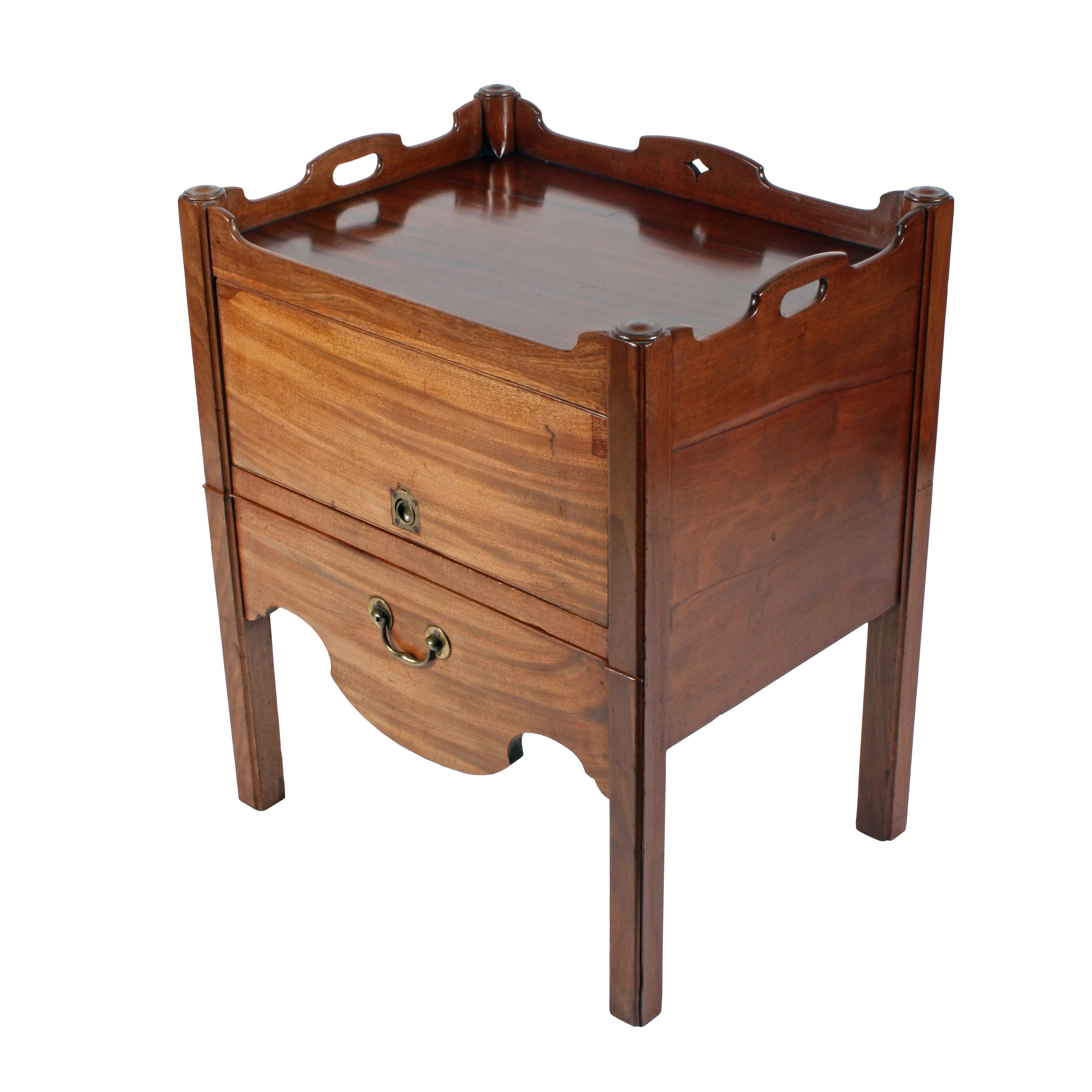 An 18th century Georgian mahogany tray top converted bedside commode.

The commode stands on four square legs with a chamfered edge, has an up and over door to the front and a slide out tray.

The door has a military style ring handle and the