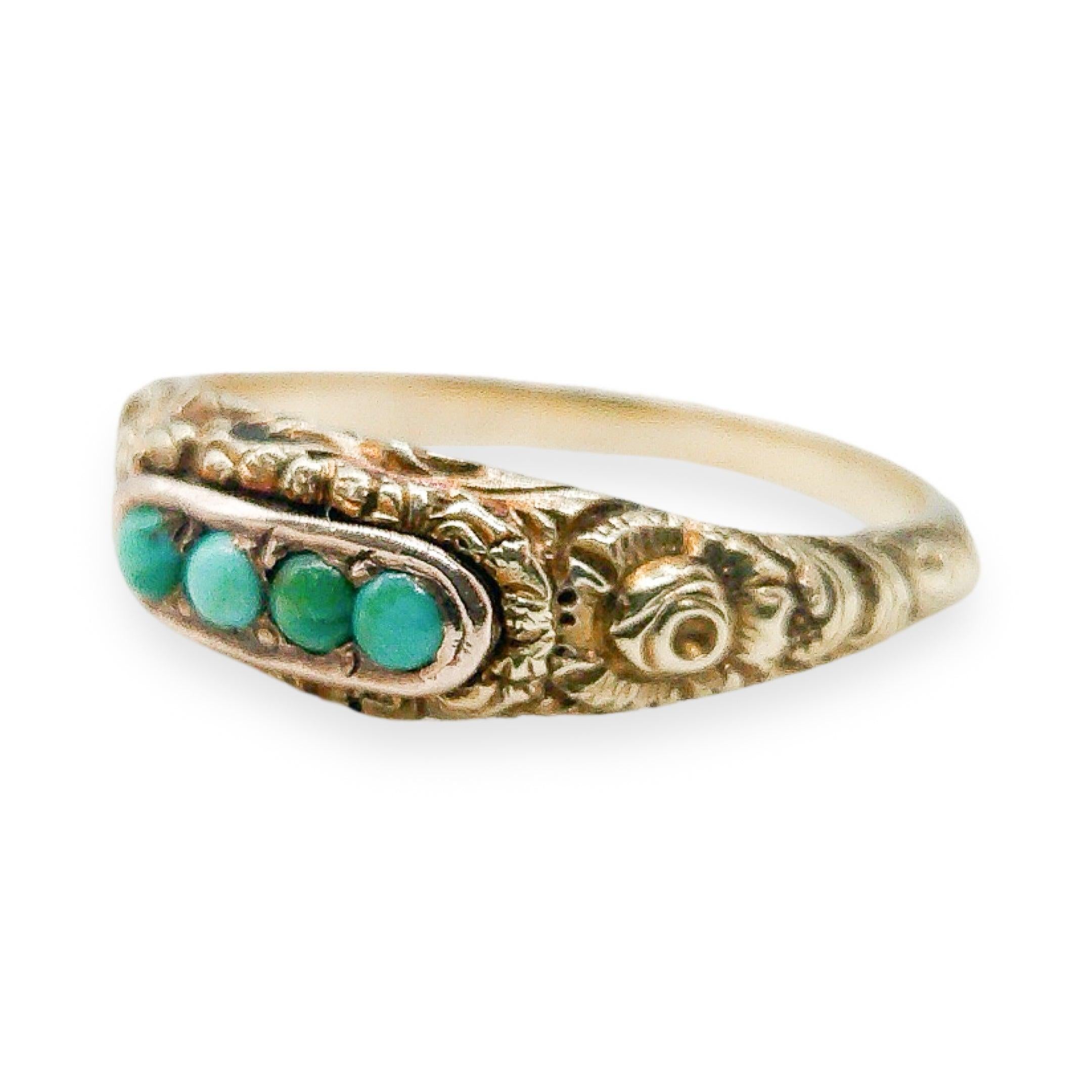This gorgeous Georgian Turquoise ring was meticulously handcrafted in 1833. Set in 10k gold this exquisite piece features a half-band adorned with intricate floral scrolls that create a captivating design. At the center of the ring, you'll find four