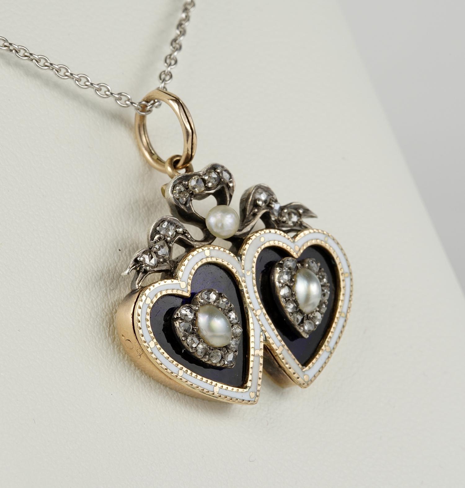 Romantic Georgian period tween heart pendant 18 kt /Silver set
Modelled as two hearts entwined by a gorgeous Diamond bow as symbol of enduring love, pearl is seal of purity
Adorned by Royal Blue and White enamelling and natural not nucleated Pearls