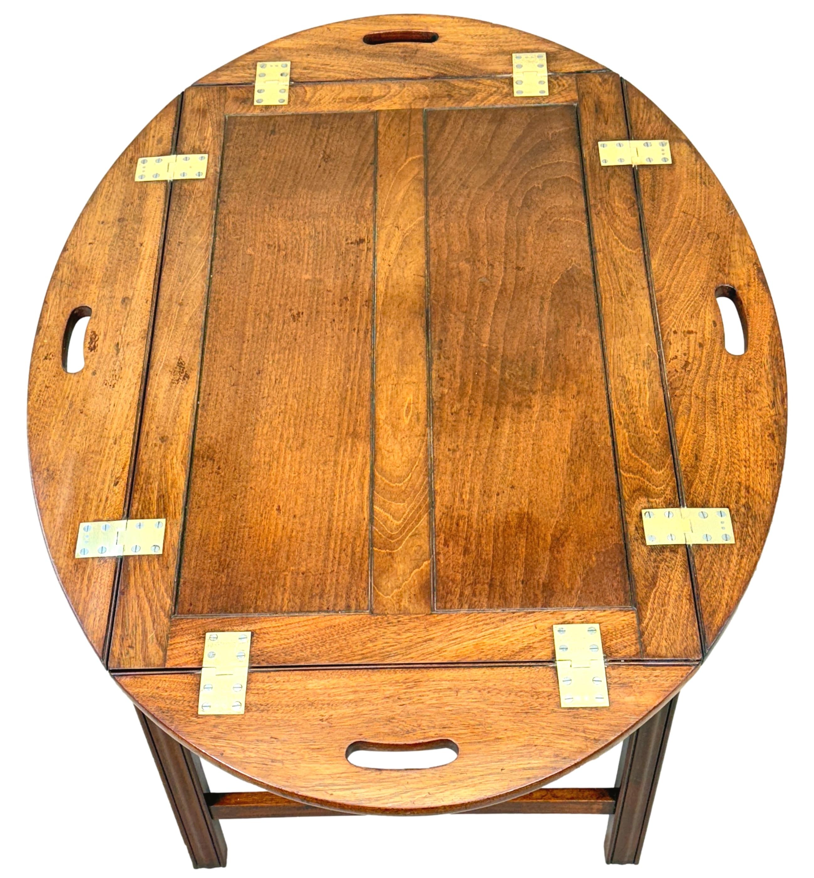 An Exceptional Quality Late 18th Century, George III Period, Mahogany Oval Butlers Tray, Of Unusual Two Panel Construction, Retaining Superb Colour And Figuring To Top, With Original Brass Hinges To Folding Sides And Pierced Carrying Handles, Raised