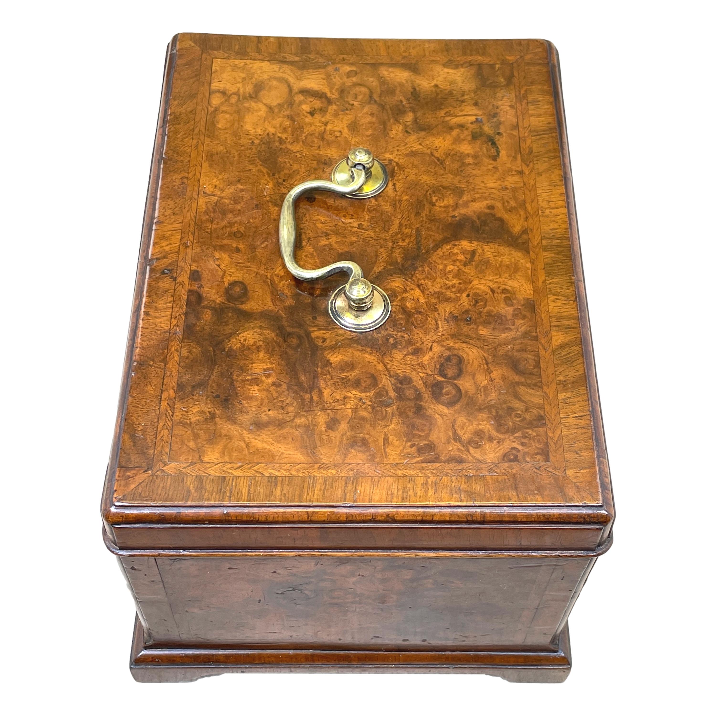 A very fine George II period 18th century burr walnut tea caddy having superbly figured top with original brass swan neck handle enclosing divided interior, with cross banded and herringbone inlay decoration throughout, canted corners and original