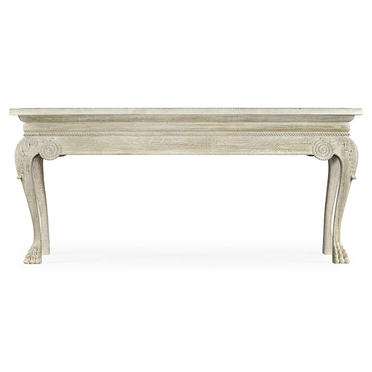 A Georgian style white painted oak console table with a white marble inset top, with an unusual rope-carved molding, a crosshatch carved frieze, carved acanthus knees on cabriole legs and carved lion paw feet.

Dimensions: 78