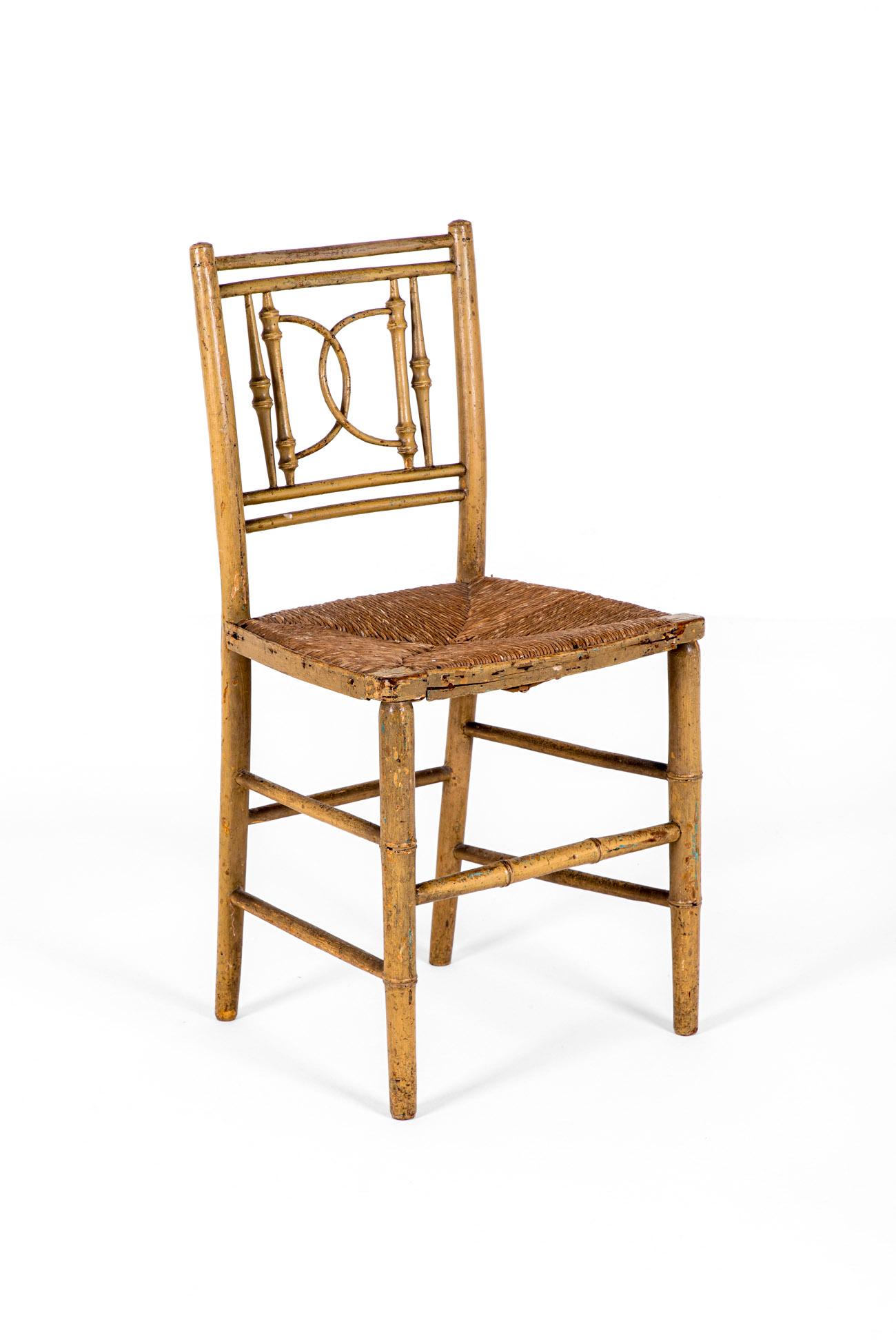 A charming faux bamboo Georgian painted side chair with a rattan seat.

The chair exhibits a double rail to the top with interesting demi lune spindles and two shaped supports beneath.

Beneath the comfortable seat are double parallel stretchers to