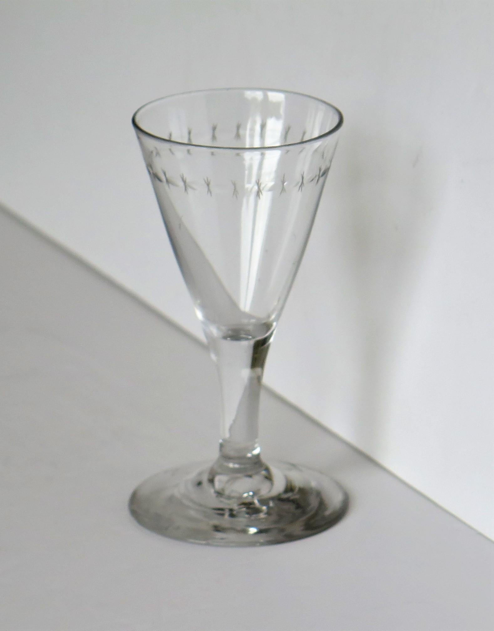 This is a good English, hand blown George 111rd period, engraved wine drinking glass, from the late 18th century, circa 1790. 

It is individually hand blown, from lead glass and as such is unique, with no two glasses being identical. 

18th