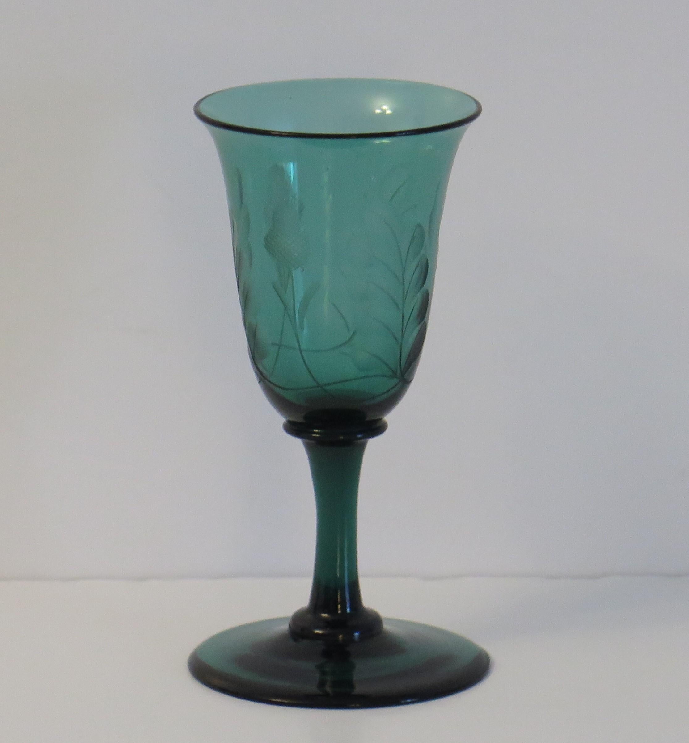 This is an excellent example of an early 19th century, English, hand blown, Bristol green wine drinking glass, with an engraved bowl of acorns and oak leaves. which we date to the George 111rd Regency period, circa 1815.

This glass has an elegant