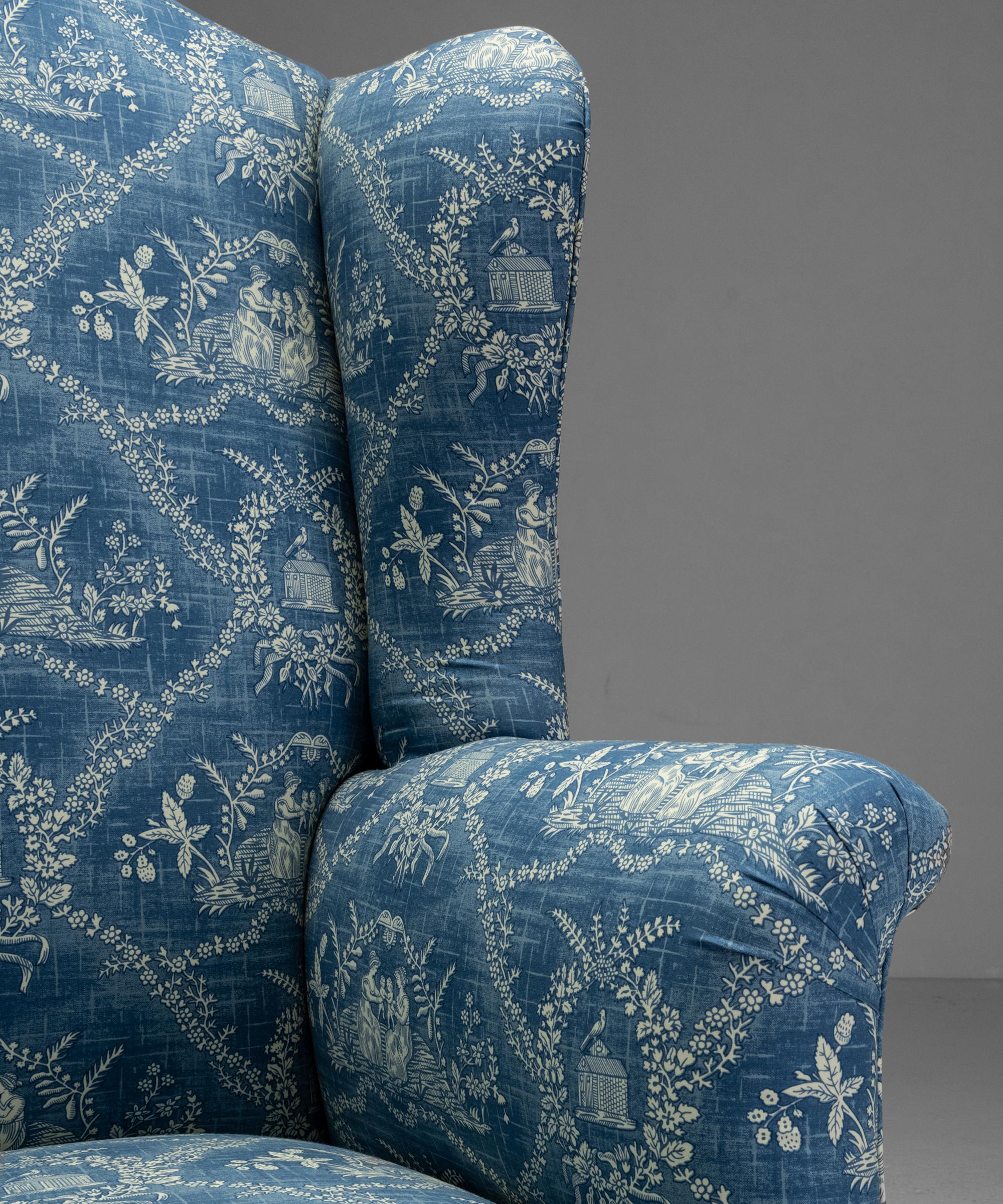 Georgian wingback armchair in 100% cotton toile fabric from Pierre Frey

England Circa 1770

Newly upholstered in Blue / Ivory Toile Fabric from Pierre Frey. On dark stained tapered wooden legs.

Measures: 28