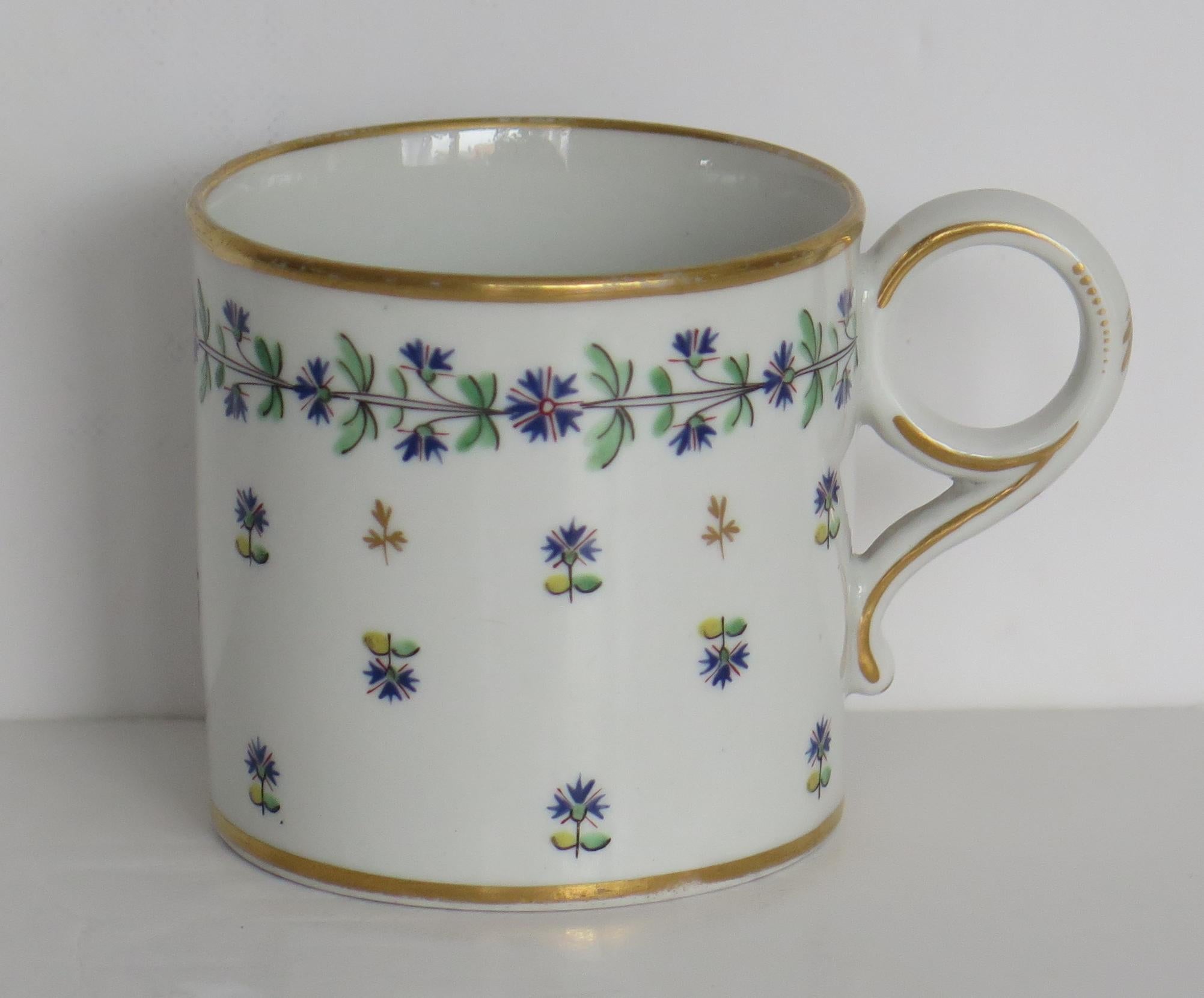 This is a high quality coffee can in a hand painted and gilded pattern made by Worcester during the Barr period (B) of George 111rd years, circa 1807-1813.

The coffee can is well potted and nominally parallel, with a ring handle. It has a shallow