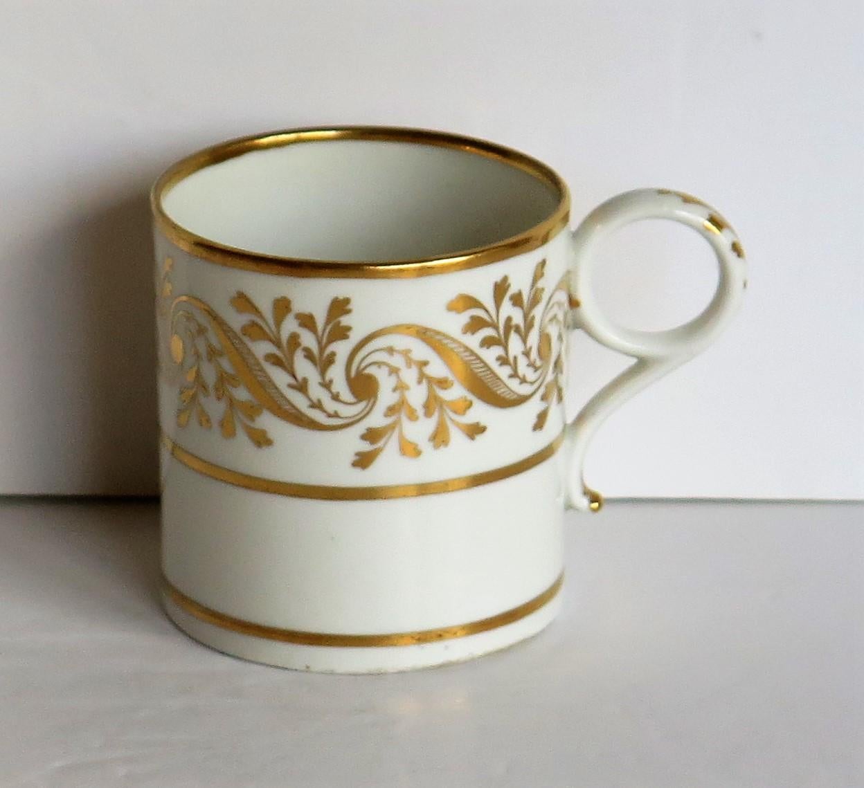This is a very good quality coffee can in a hand gilded pattern made by Worcester during the Barr, Flight & Barr period (BFB) of George 111rd years, circa 1807-1813.

The coffee can is well potted and nominally parallel, with a ring handle. It has