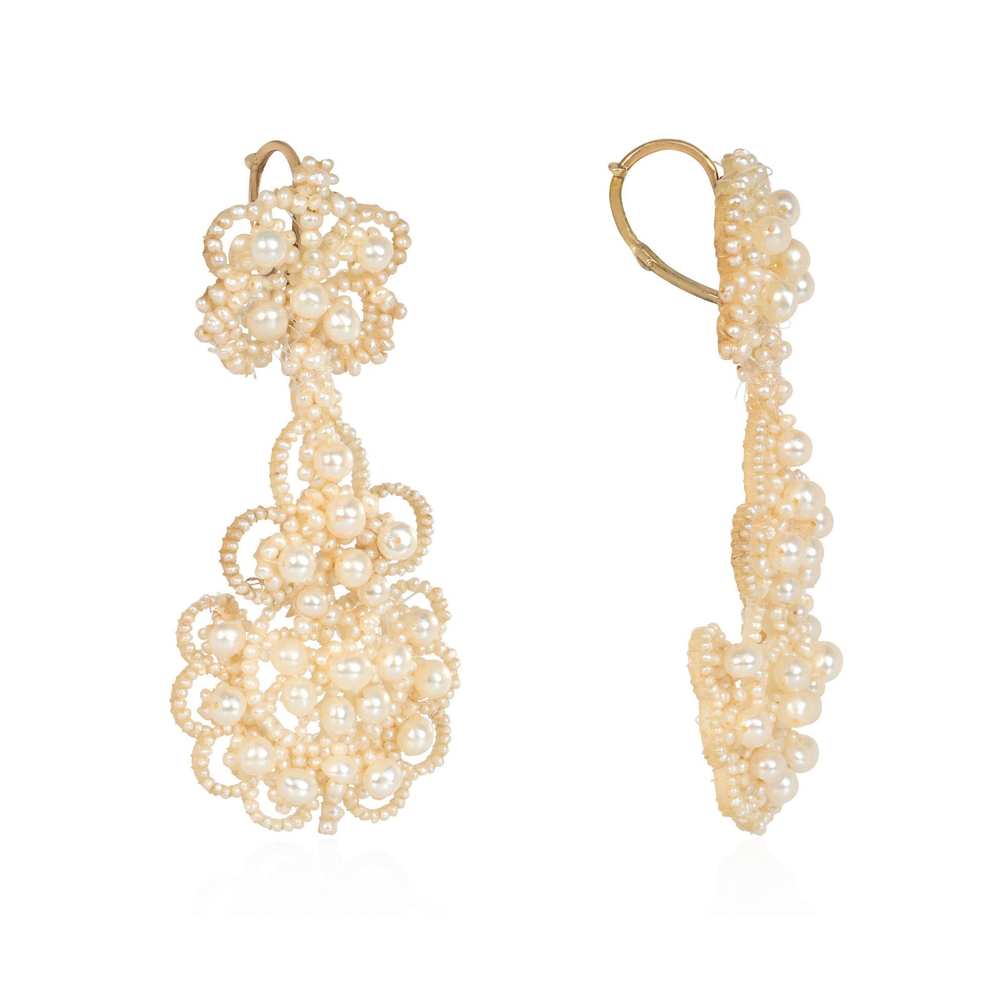 A pair of antique Georgian seed pearl chandelier earrings of woven lace-like design with 15k gold lever backs.  England