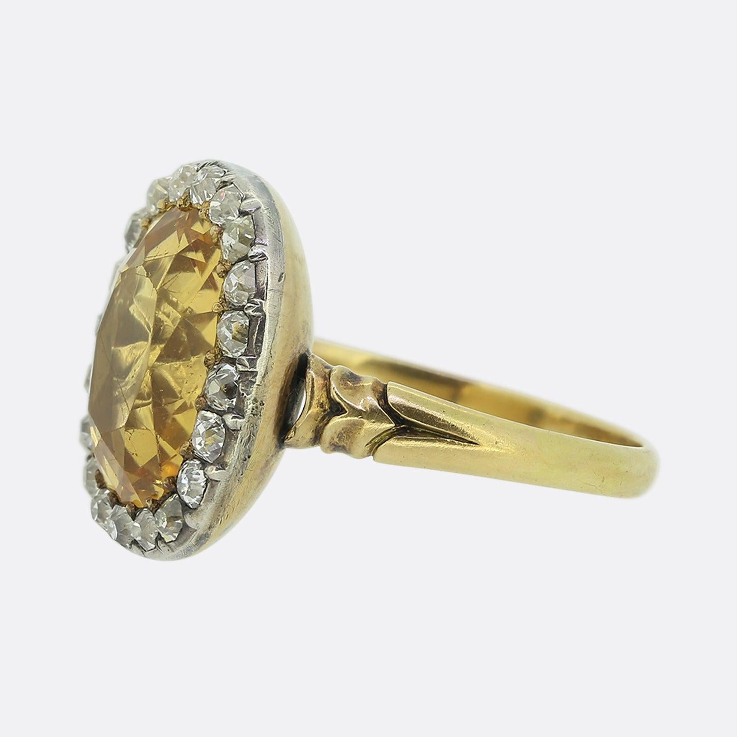 Here we have a remarkable antique cluster ring dating back to the Georgian period. A striking rich yellow topaz enchants at the centre of the face and is framed by a halo of chunky old mine cut diamonds around the outer edge. All stones here are