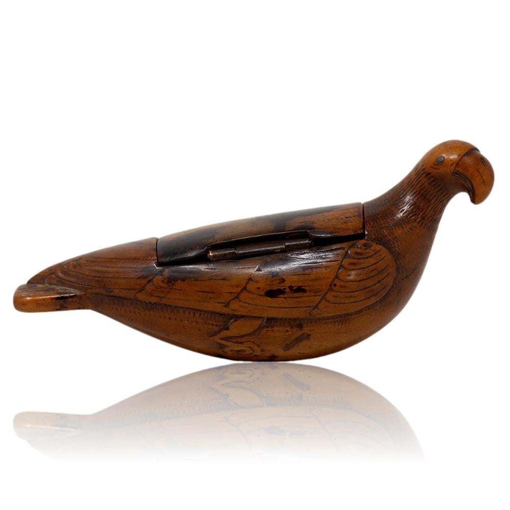 18th Century George III Period 

From our collectables, we are delighted to offer this Georgian Yew Wood Parrot Snuff Box. The snuff box made from Yew wood is beautifully formed in the shape of a parrot with big round beak, simulated feathers and