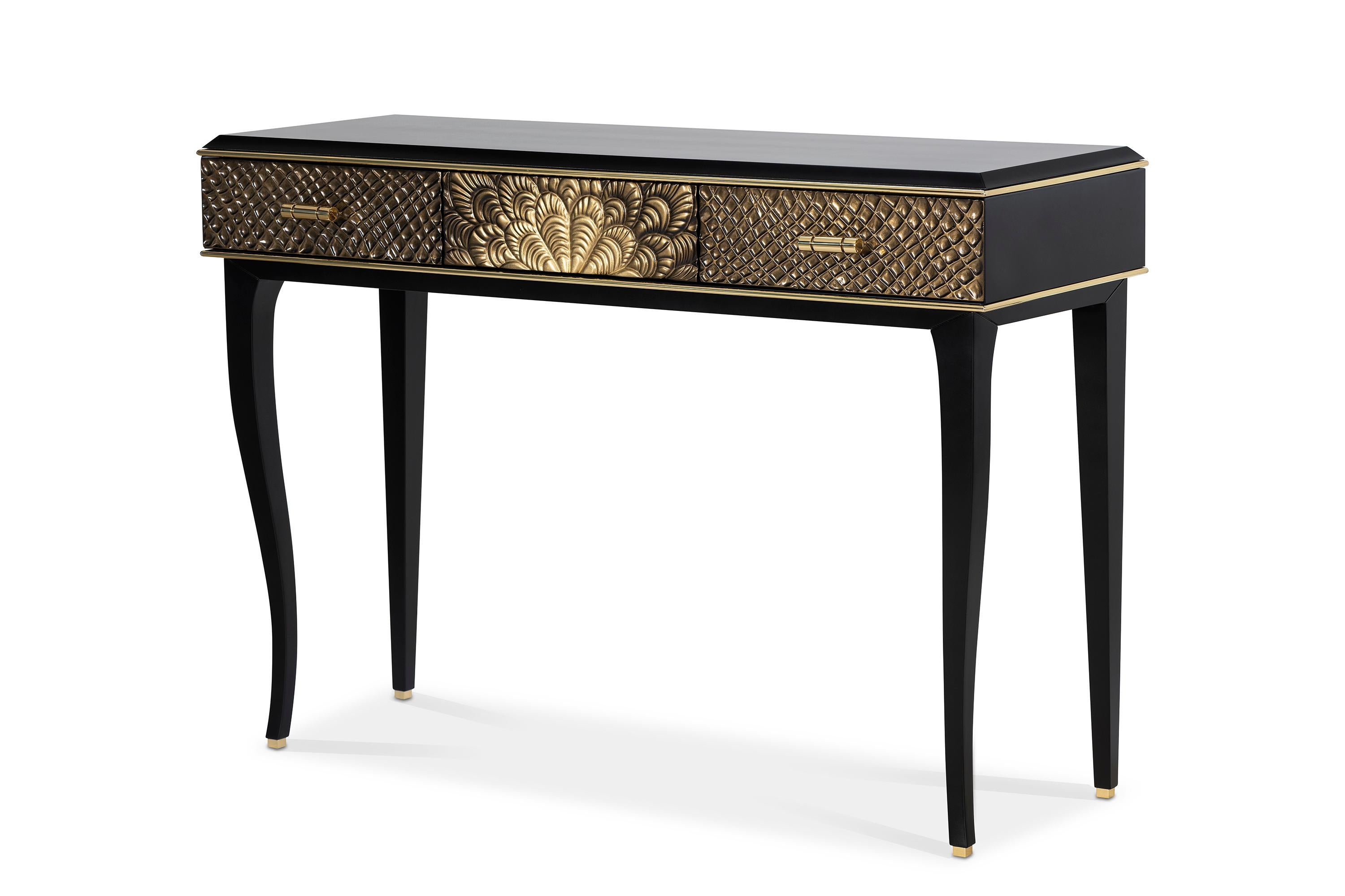 Georgiana console it's a mysterious piece that creates feelings through the colors and the different materials such as the textured, the black lacquered and the polished brass.

The textures presented in the drawers, the golden frieze in