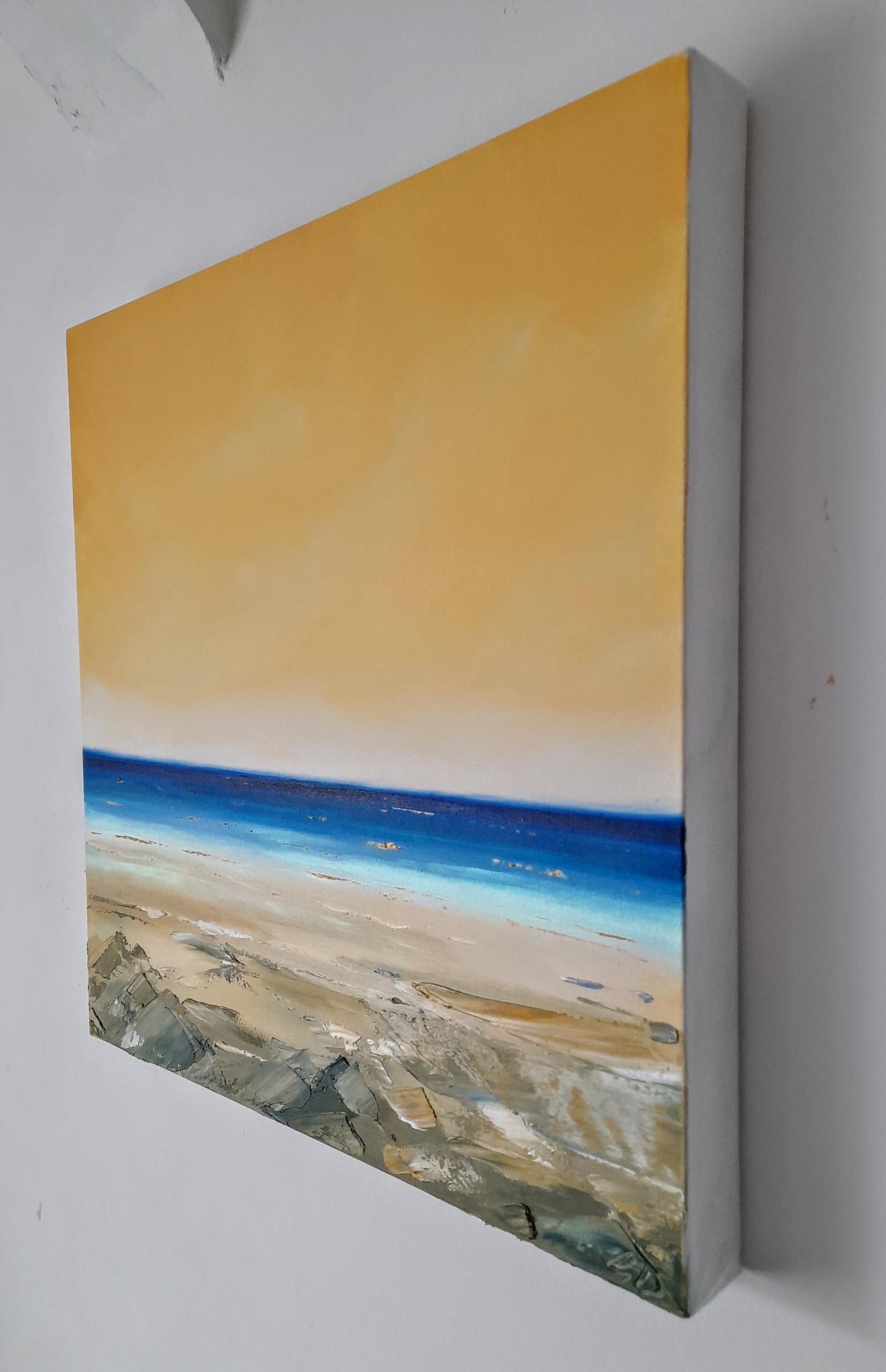 'Gloaming Coast' is an original oil painting on fine canvas portraying a view out to sea from the beach as the sun is setting. The sky is a warm muted orange, contrasting with the deep blues in the sea. The waves and ripples in the water reflect the