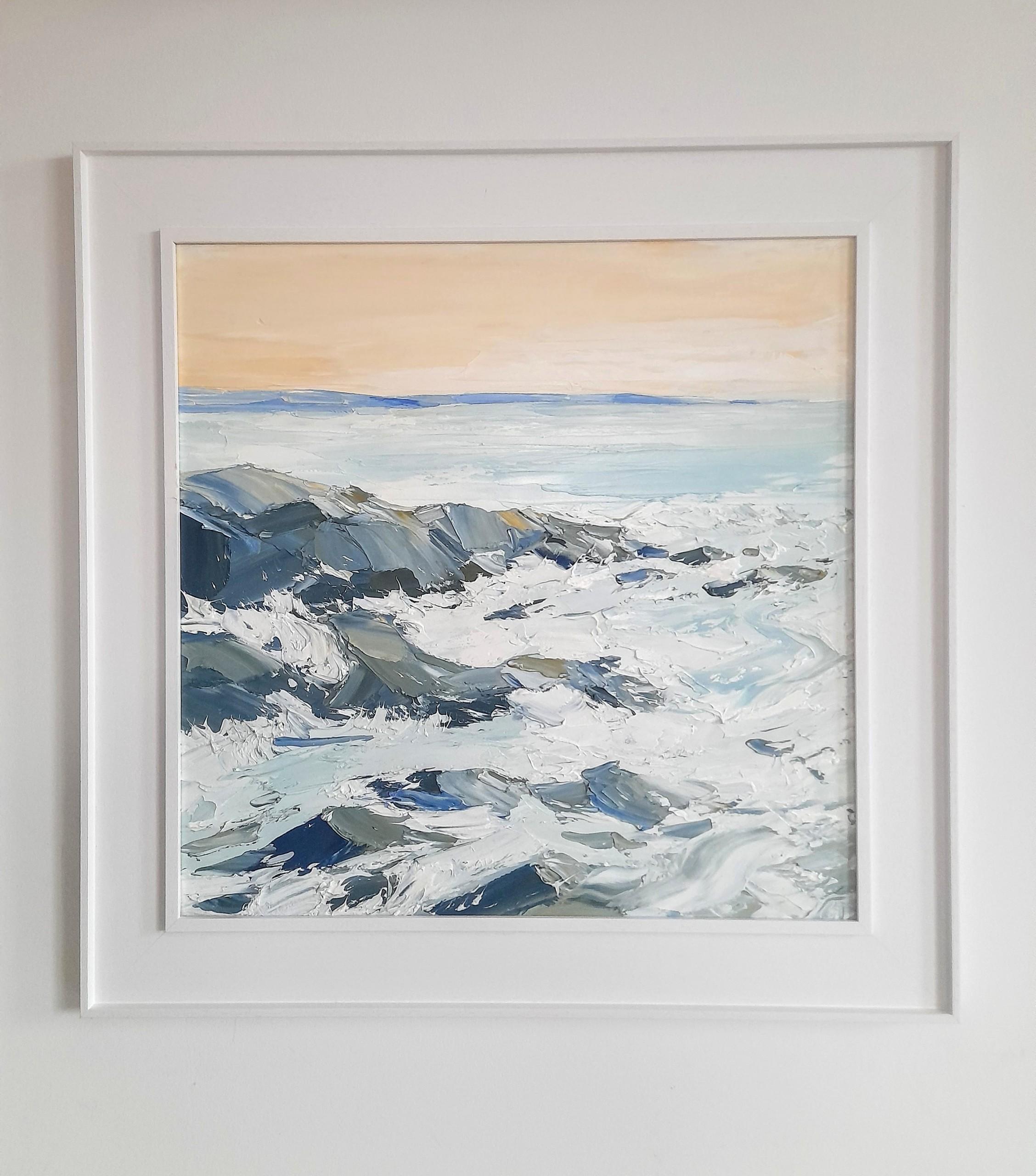 Incoming tide at the breakwater by Georgie Dowling is an original oil painting portraying the scene of the incoming tide crashing over the rocks at the breakwater in Bude, Cornwall. The scene portrays an evening on the coast with a warm sky and