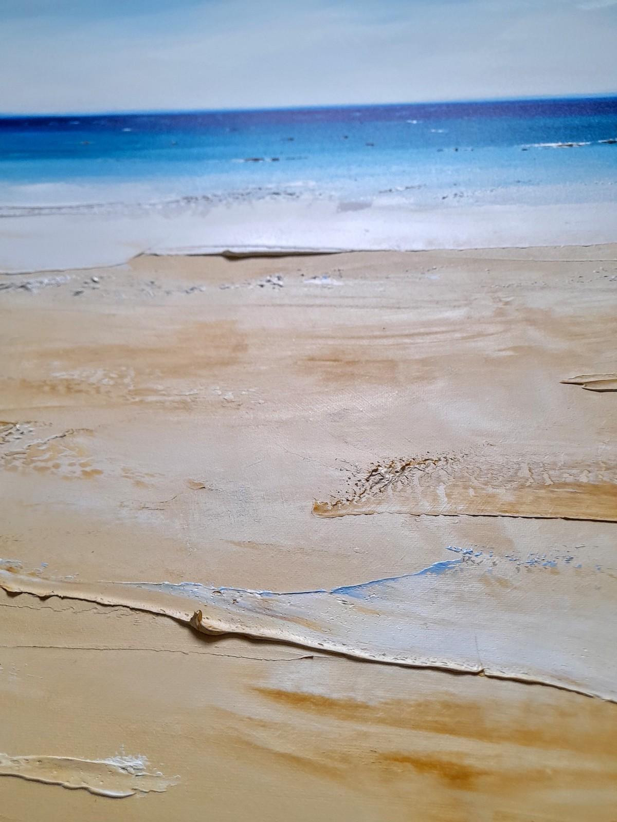 An original oil painting on fine cotton canvas portraying a beautiful summers day on the beach. The distant sea sparkles under the bright sky of the day while gentle waves make their way through the sea and over the sand into the foreground. The