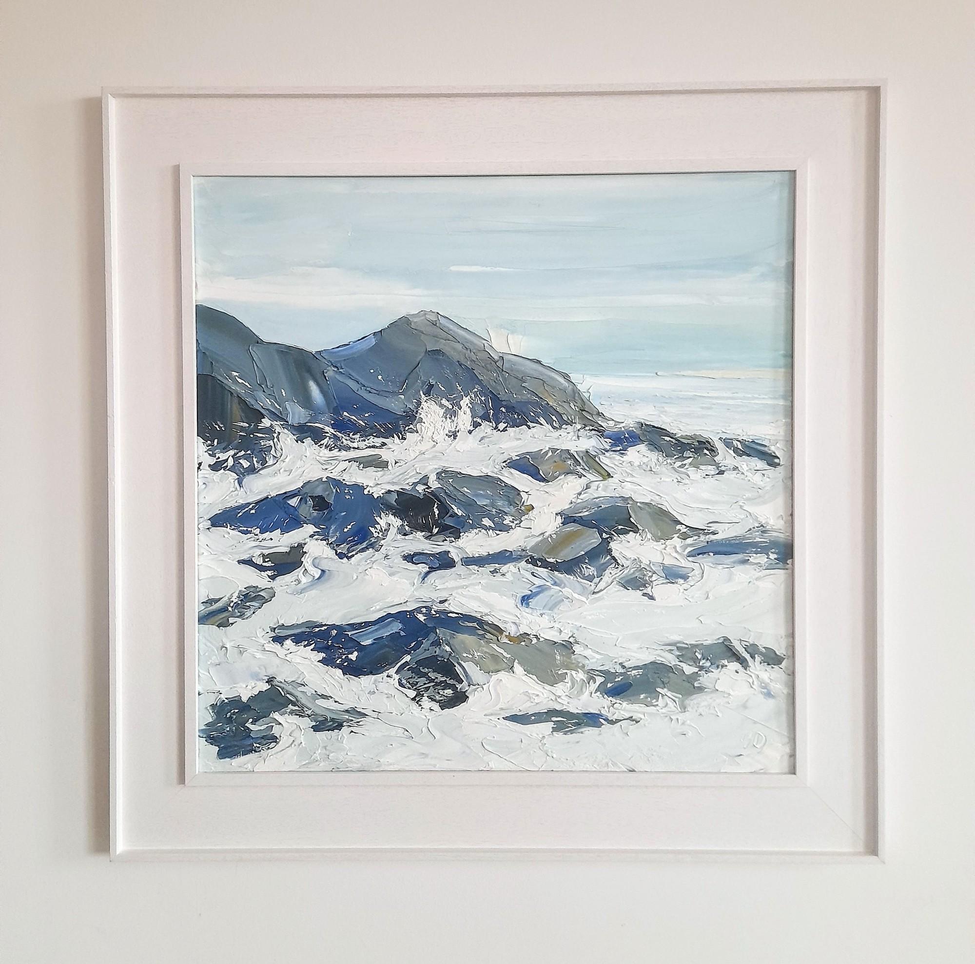 White Water by Georgie Dowling is an original oil painting portraying the scene of the sea crashing over the rocks at the breakwater in Bude, Cornwall. The colour palette is cool and muted yet is full of varied tones. The paint was applied thickly
