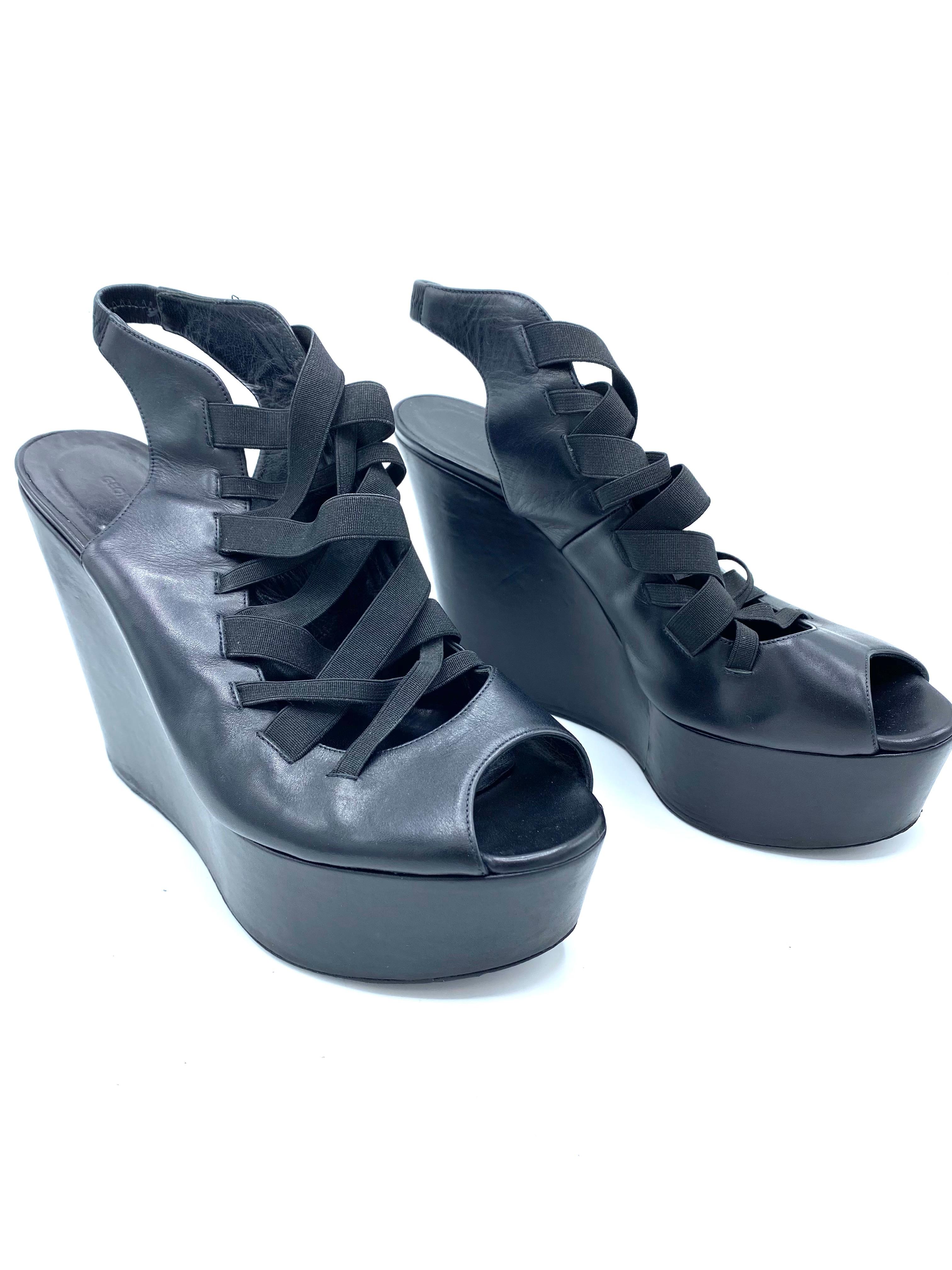 Product details:

The shoes feature black leather, open toe, the platform measures 5
