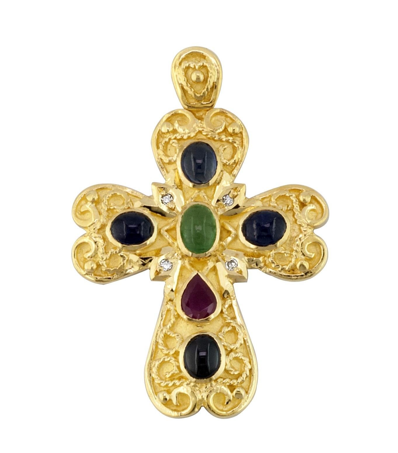 S.Georgios Byzantine Style Cross is handmade from solid 18 Karat Yellow Gold and has Granulation work and a beautiful matt finish. It features Diamonds total weight of 0,06 Carats, and a Ruby, an Emerald, and Sapphires all total weight of 2,60