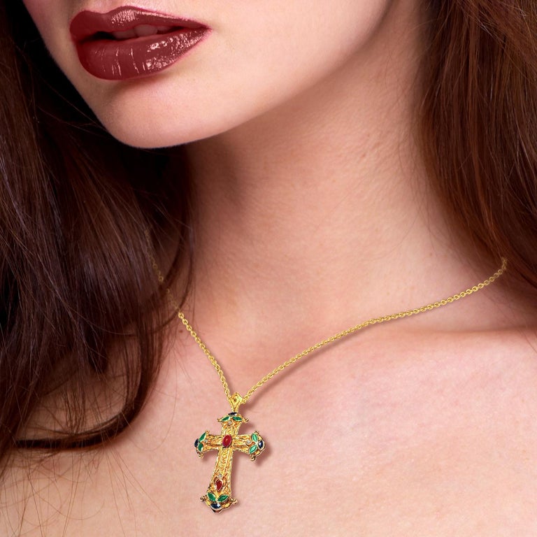 S.Georgios Byzantine Style Cross is handmade from solid 18 Karat Yellow Gold and has Granulation work and a beautiful mat finish. It features Diamonds total weight of 0,10 Carats, and Rubies, Emeralds, and Sapphire all total weight of 2,50 Carat.
