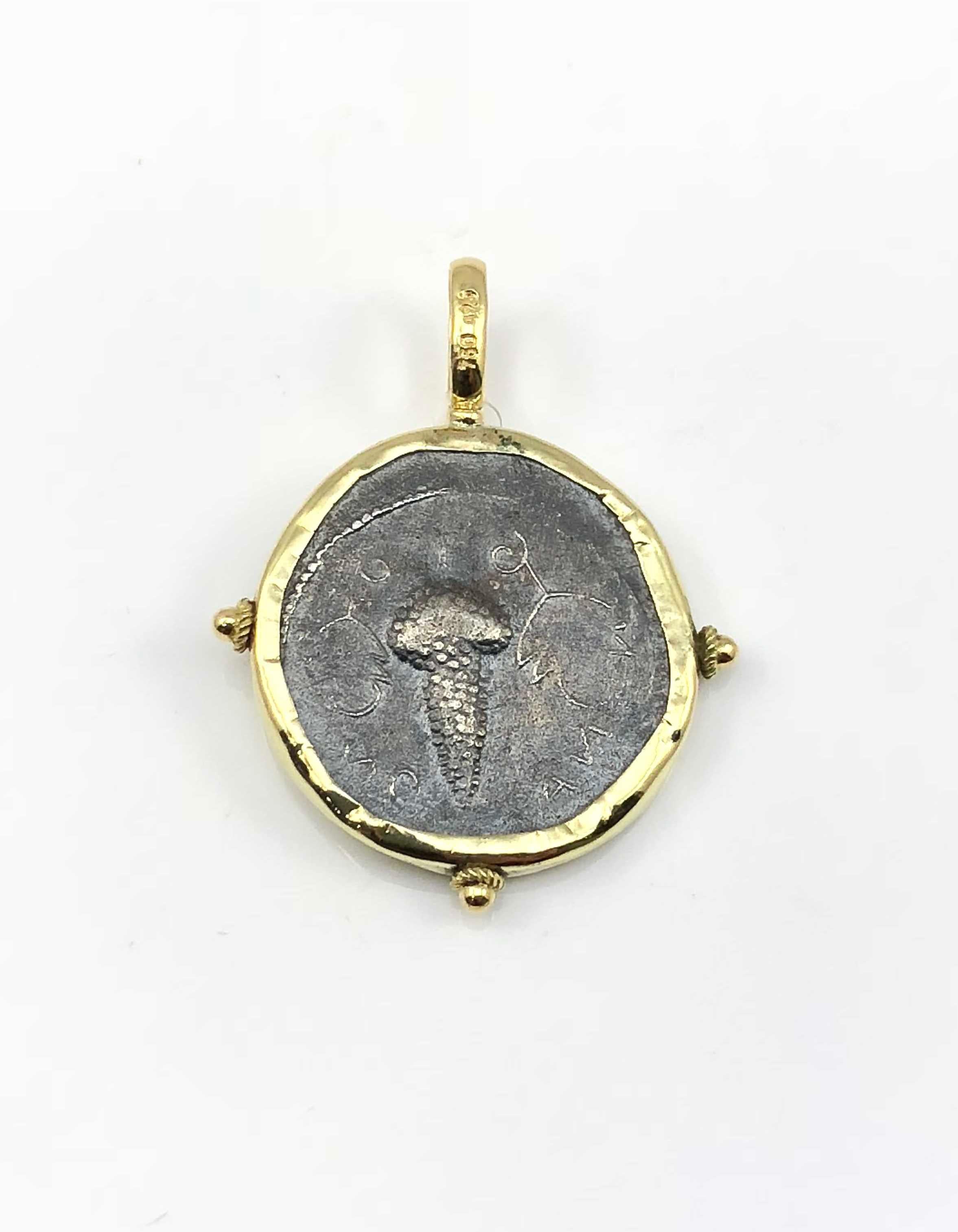 S.Georgios designer 18 Karat Yellow Gold handmade Pendant Necklace featuring a replica of an Ancient Greek Dionisis Coin in Silver 925. The coin has a beautiful reverse side and can be worn both ways. The rim and hook of the pendant are solid 18
