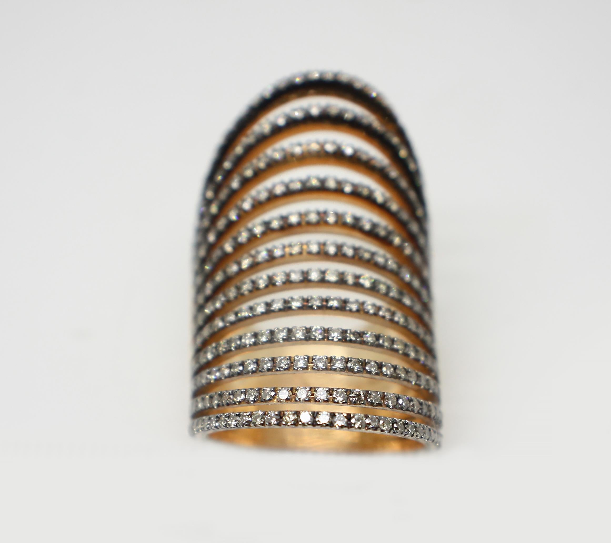 S.Georgios designer 18 Karat Rose Gold Brilliant Cut Champagne Chocolate Diamond Long Ring is all handmade in a unique design. The gorgeous ring features diamonds total weight of 2.50 Carat is made of a wide spiral design and finished with Black