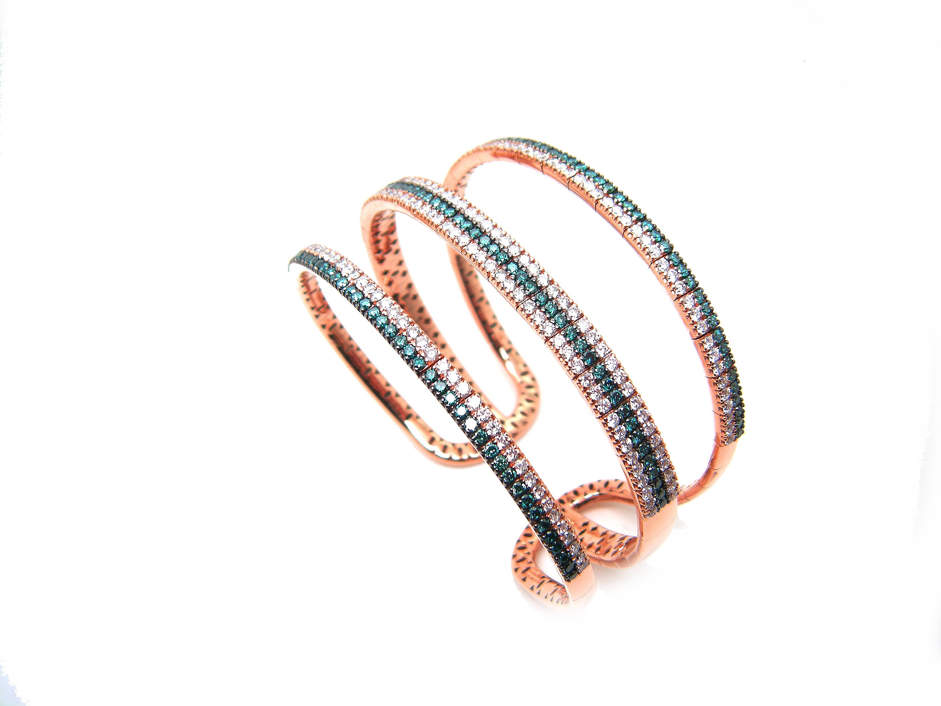 This S.Georgios designer wide bangle bracelet is rose gold 18 karats with brilliant-cut white and blue diamonds all handmade in a unique design. The gorgeous cuff Bracelet is custom made and has brilliant cut white diamonds total weight of 3.64