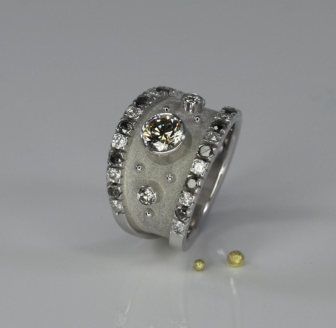 S.Georgios Designer Ring is all handmade from solid 18 Karat White Gold and is microscopically decorated with white gold beads a unique Byzantine velvet background. The Ring features a 0.75 Carat Brilliant cut Chocolate Diamond center and 2