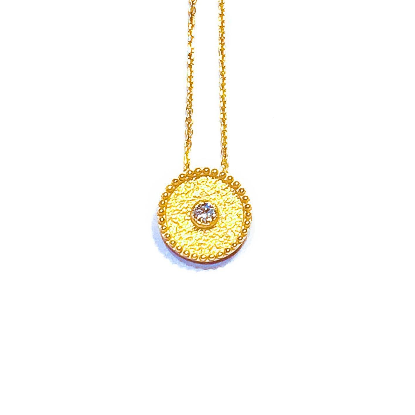 This S.Georgios designer solitaire pendant is all handmade from solid 18 Karat Yellow Gold and is microscopically decorated with granulation work all the way around. The background of the gorgeous pendant has a unique velvet look on the background