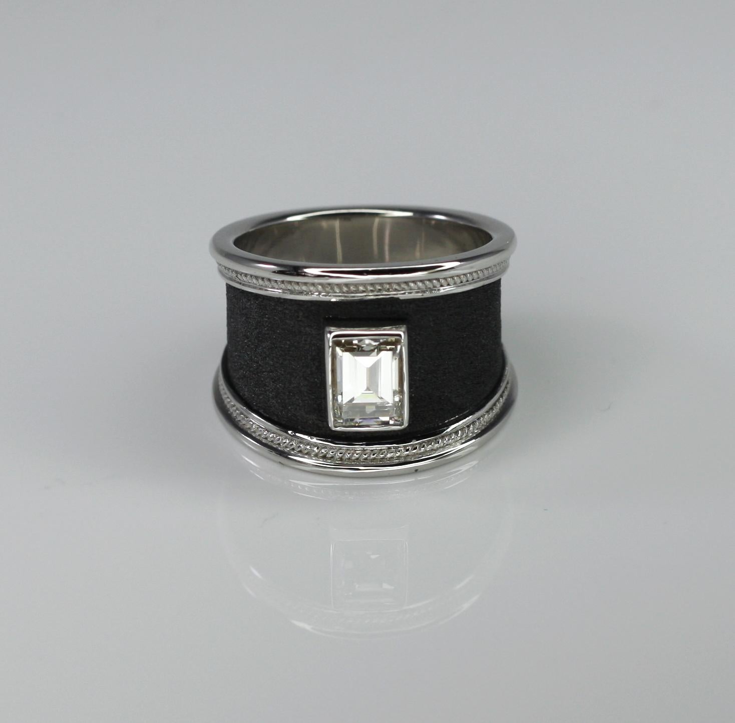 S.Georgios design ring handmade from solid 18 Carat White Gold and decorated with granulation and Byzantine velvet background finished in Black Rhodium.  This gorgeous unisex ring features a 1.16 Carat Emerald Cut White Diamond of exceptional