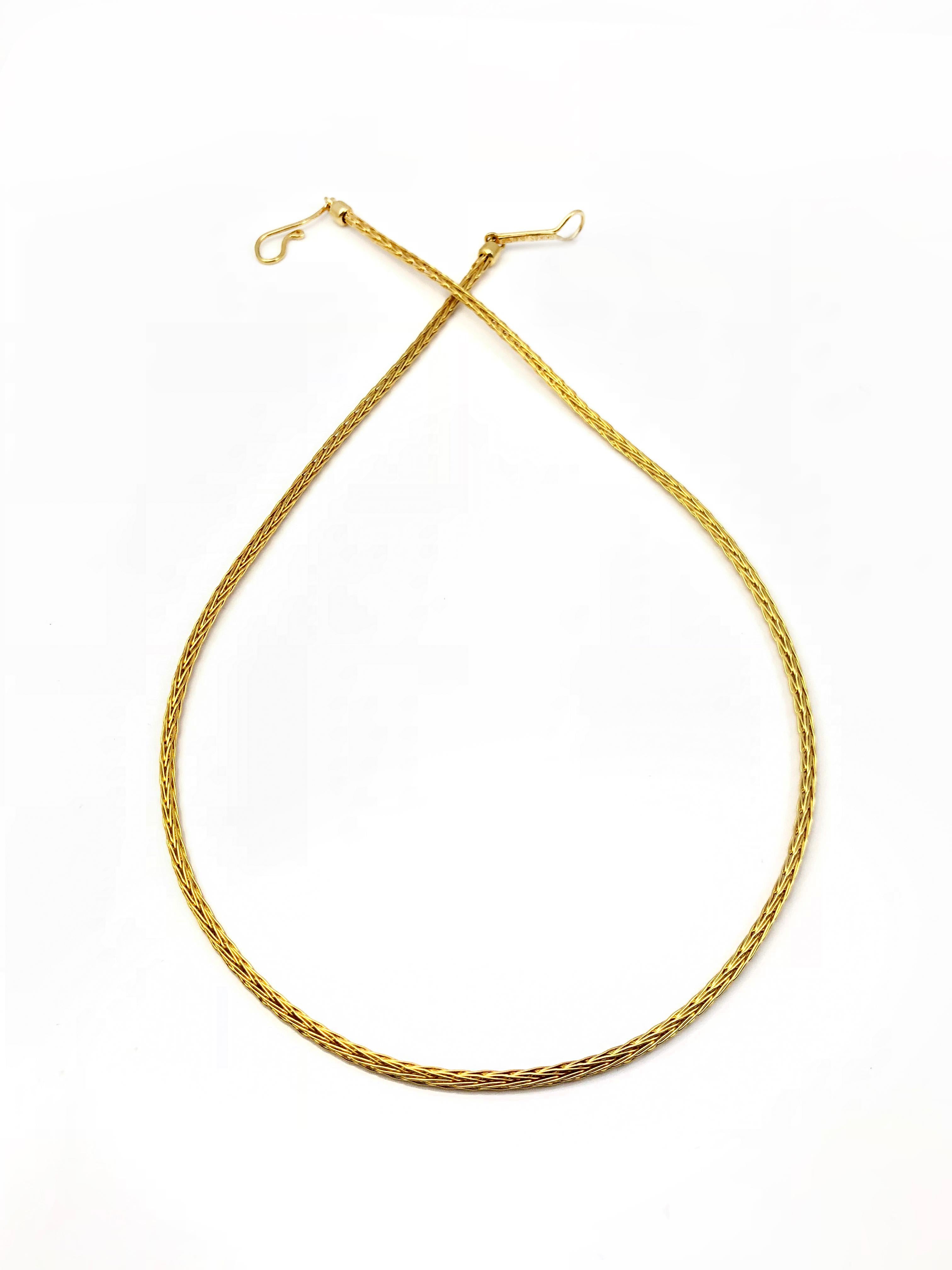 S. Georgios hand-knitted Rope Necklace is made from solid 18 Karat Yellow Gold Threads. With this chain necklace, you can wear all your slides or pendants and have a unique necklace, very different from anything around you. It can be also warren