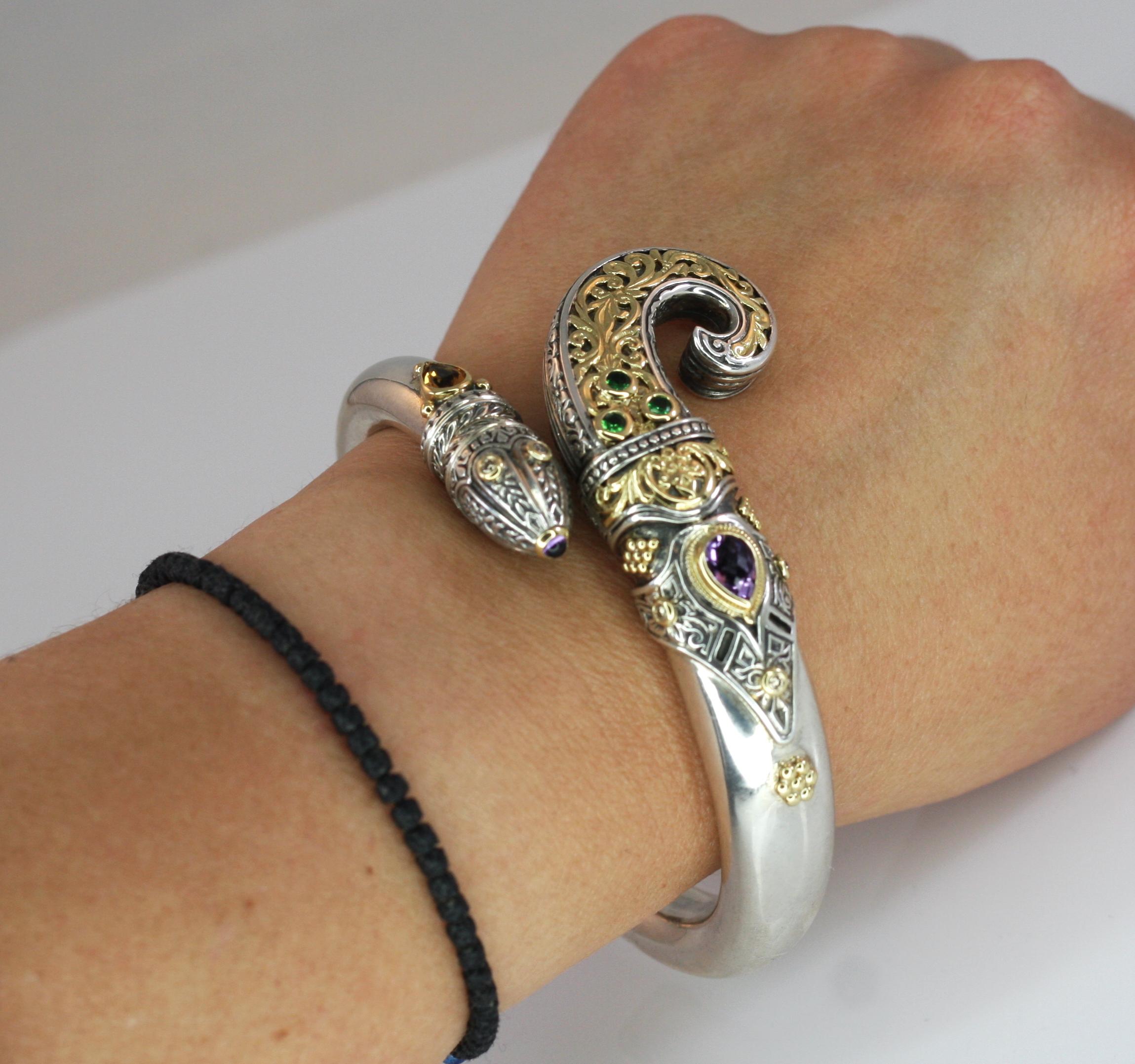Presenting all handmade heavy decorated cuff bracelet crafted from sterling silver and solid 18 Karat yellow gold to create a unique look. This animal-shaped bracelet features 1.52 Carat pear shape Amethyst, 0.80 Carat Pear shape Citrine, 0.30 Carat