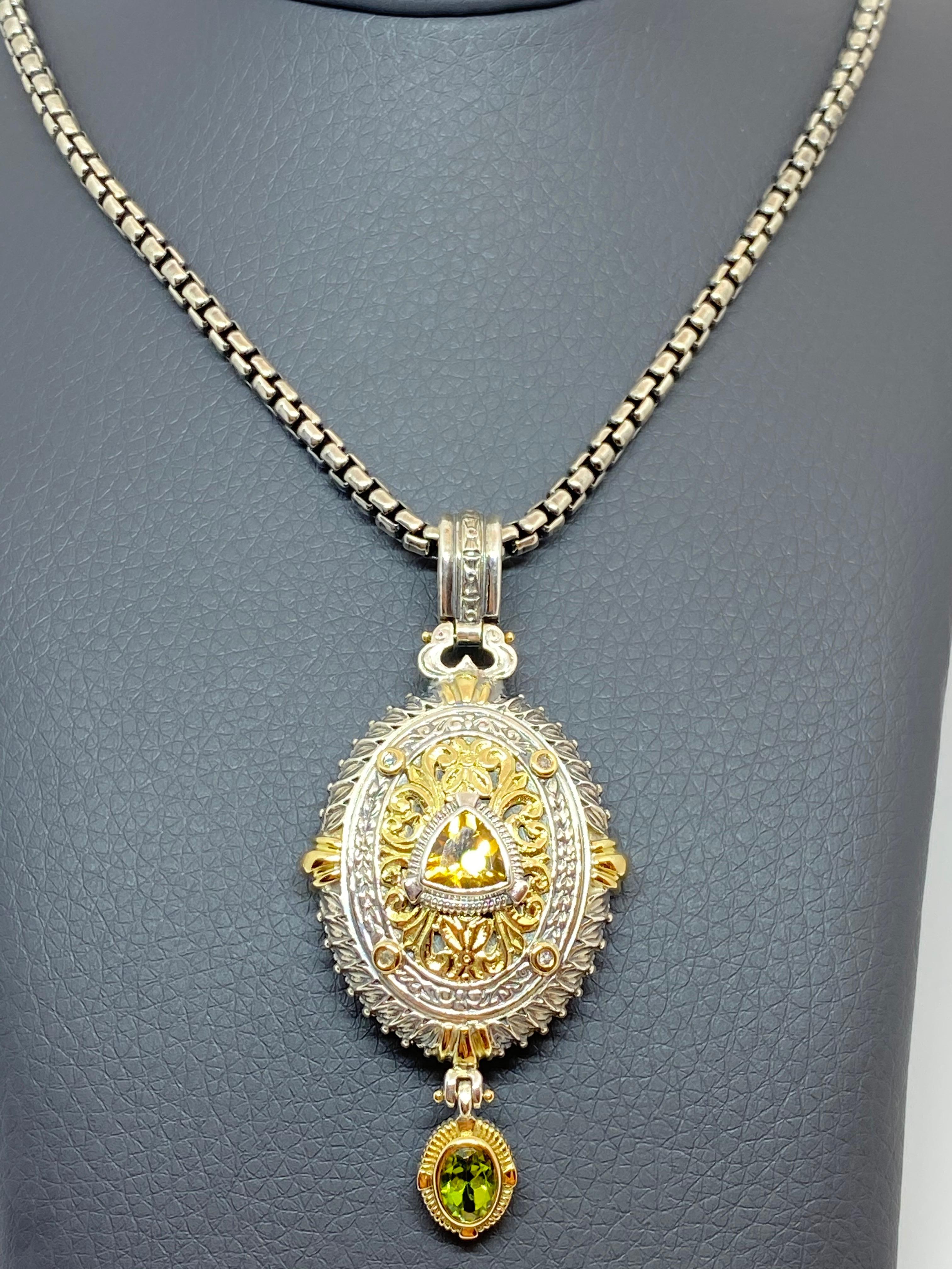 S.Georgios designer Silver and Gold 18 Karat two-tone multicolor pendant is crafted from solid 18 Karat yellow gold pieces inlaid to create a unique look. This gorgeous pendant enhancer features 4 Diamonds total weight of 0.16 Carat, a yellow