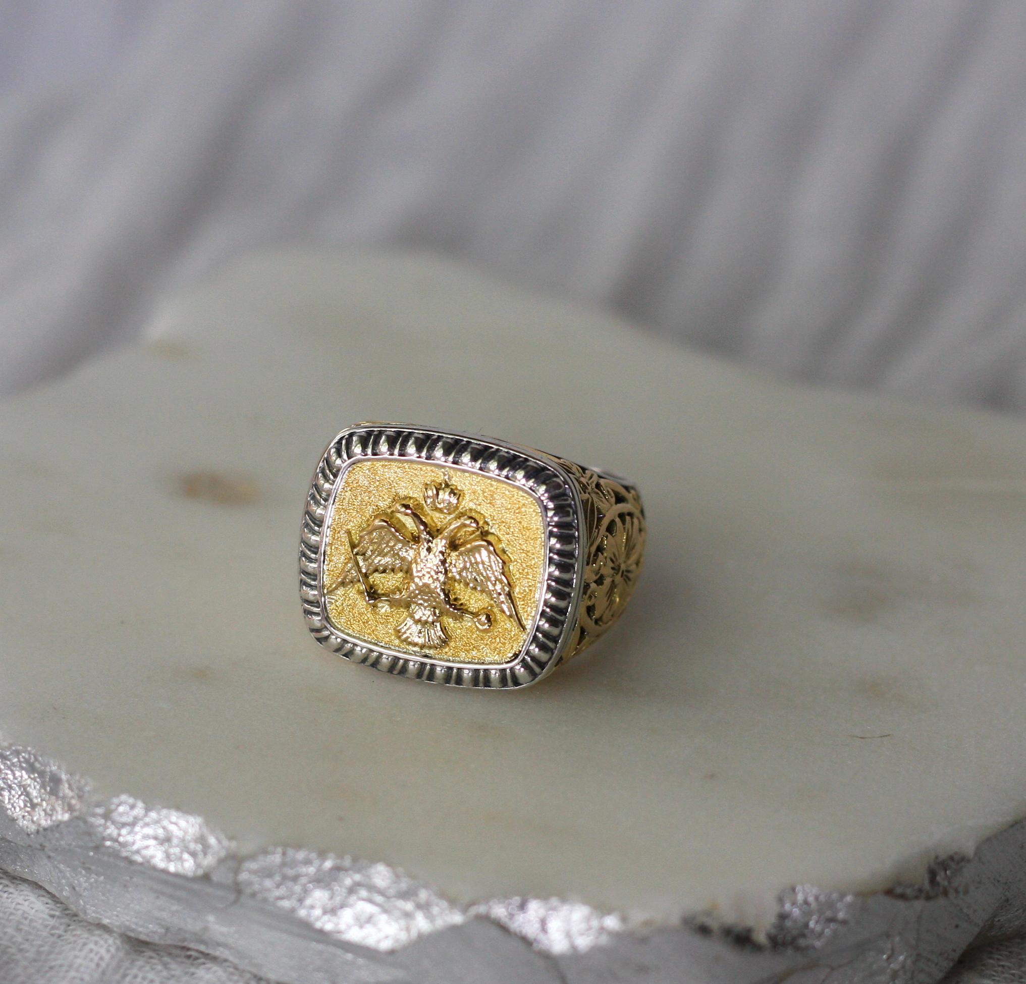 Presenting all handmade heavy decorated men's ring crafted from sterling silver and solid 18 Karat yellow gold to create a unique look. 
This gorgeous piece is outstanding in the quality of workmanship and is made in Amanatidis workshop in Athens